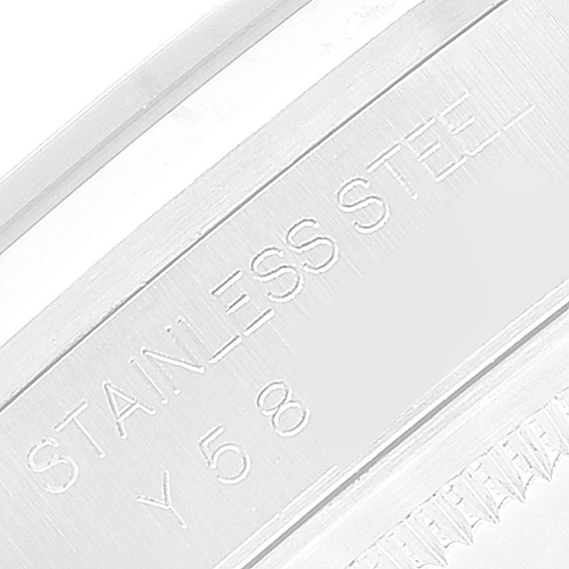 The image shows a close-up of the engraved text "STAINLESS STEEL" on a Rolex Datejust 16200 Men's Stainless Steel Blue Dial 16200 Men's Stainless Steel Blue Dial watch.