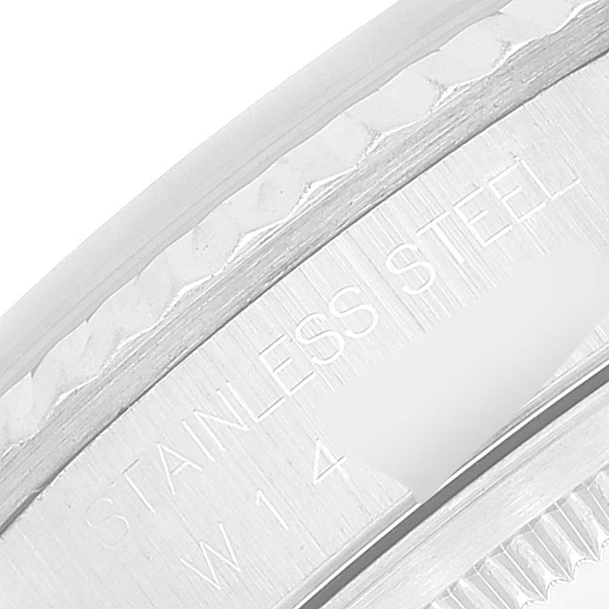 This image shows a close-up view of the stainless steel case back edge of a Rolex Datejust 16234 Men's Stainless Steel Blue Dial 16234 Men's Stainless Steel Blue Dial watch.