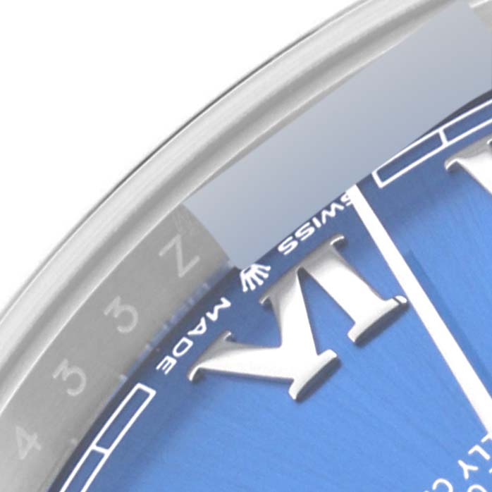 This close-up of a Rolex Datejust 41 126334 Men
s Stainless Steel Blue Dial 126334 Men
s Stainless Steel Blue Dial watch shows part of the dial and the edge of the bezel.