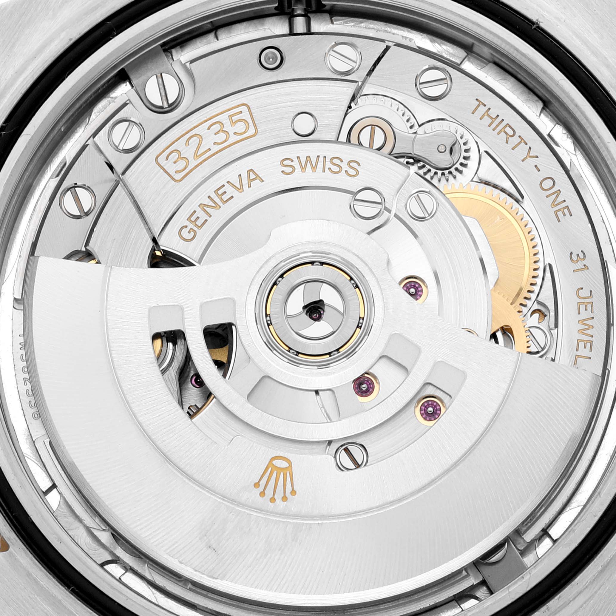This image shows a close-up of the movement mechanism inside the Rolex Datejust 41 126333 Men's Steel and Gold (two tone) Silver Dial 126333 Men's Steel and Gold (two tone) Silver Dial, highlighting the intricate components and "3235."