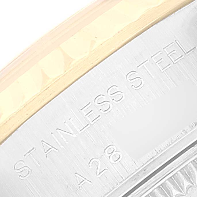 The image shows a close-up of the casing and bezel of a Rolex Datejust 79173 Women's Steel and Gold (two tone) Champagne Dial 79173 Women's Steel and Gold (two tone) Champagne Dial, highlighting the "STAINLESS STEEL" engraving.