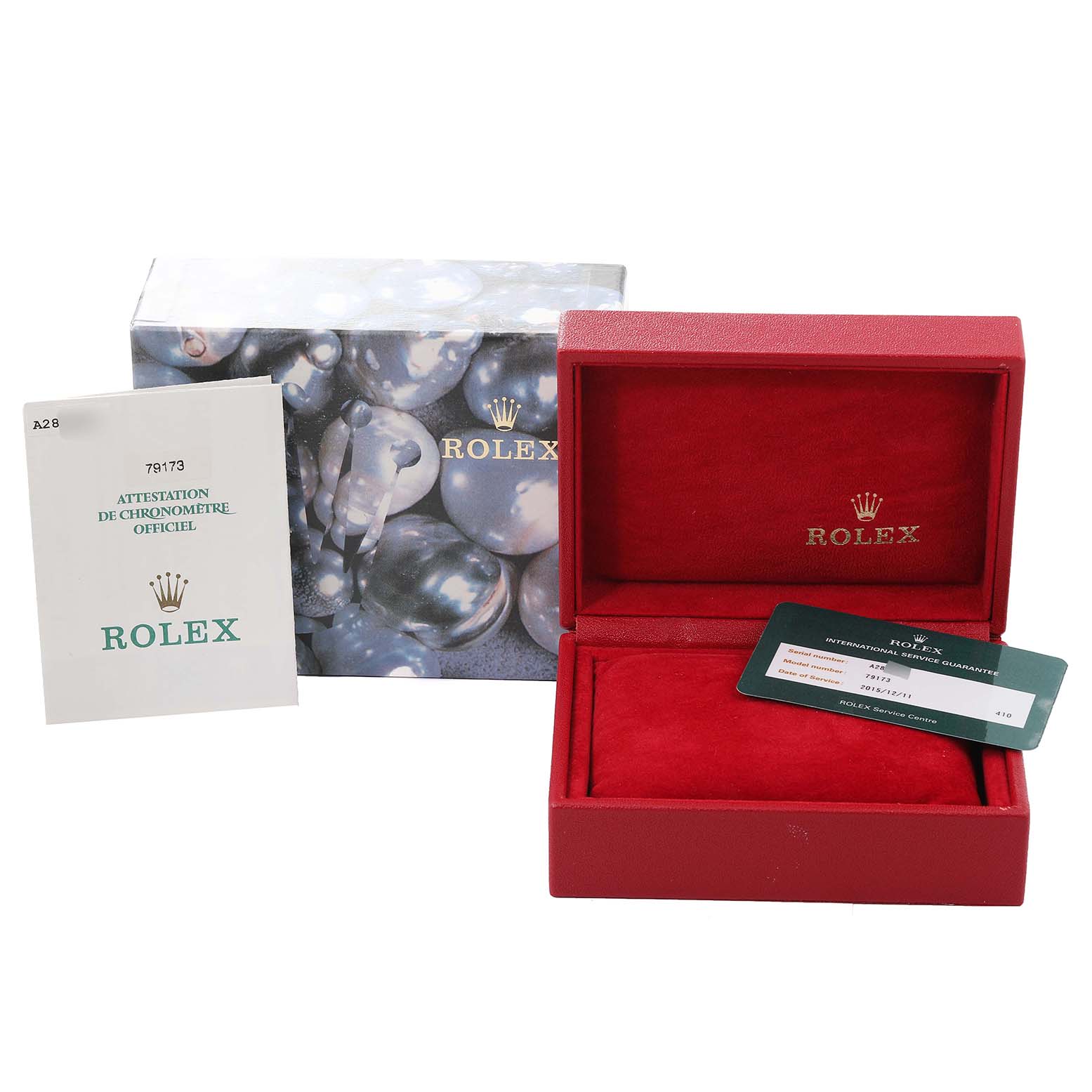 The image shows the packaging, warranty card, and manual for the Rolex Datejust 79173 Women's Steel and Gold (two tone) Champagne Dial 79173 Women's Steel and Gold (two tone) Champagne Dial model.