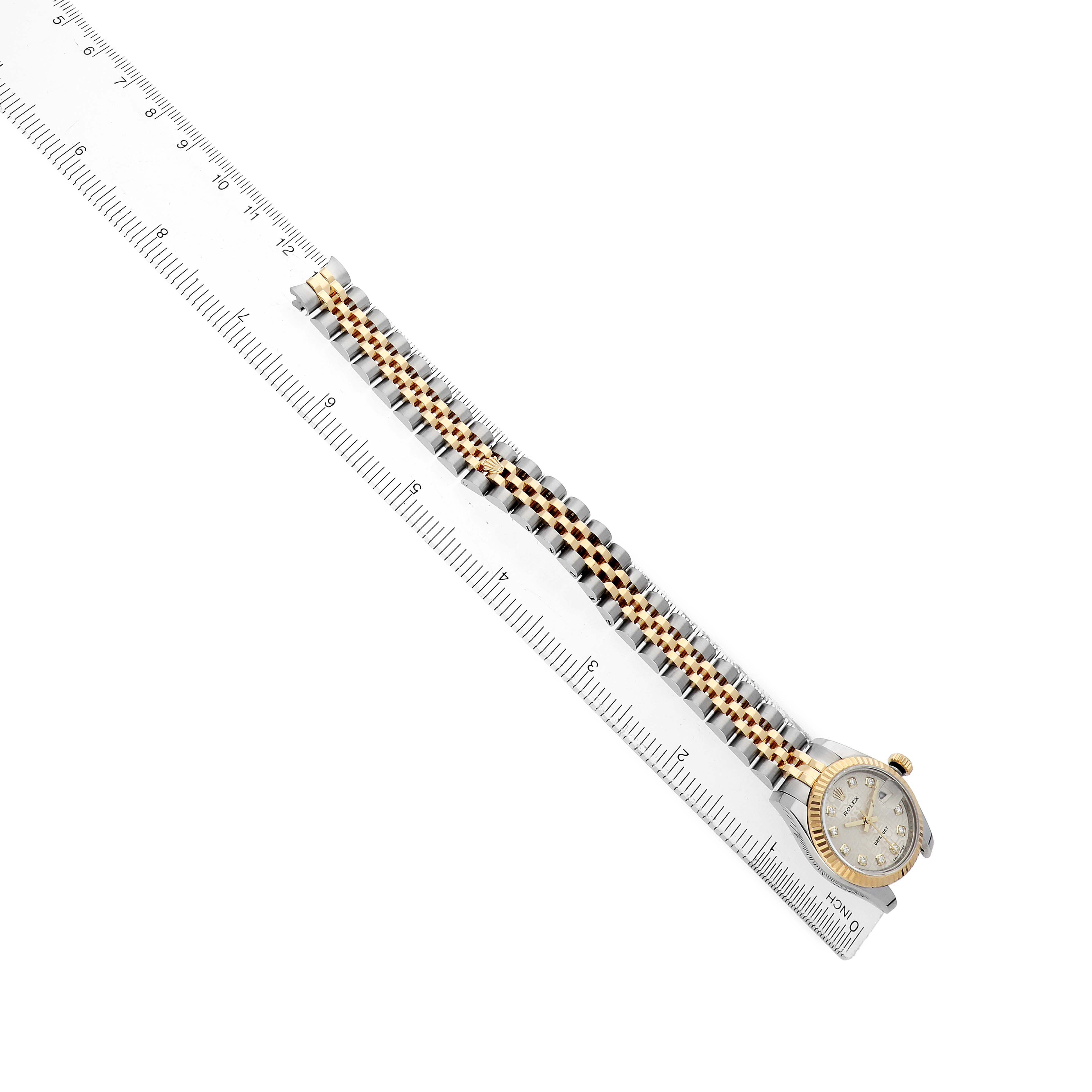 The image shows a Rolex Datejust 179173 Men's Steel and Gold (two tone) Silver Dial watch from a top view, displaying the full bracelet and watch face alongside a ruler for scale.