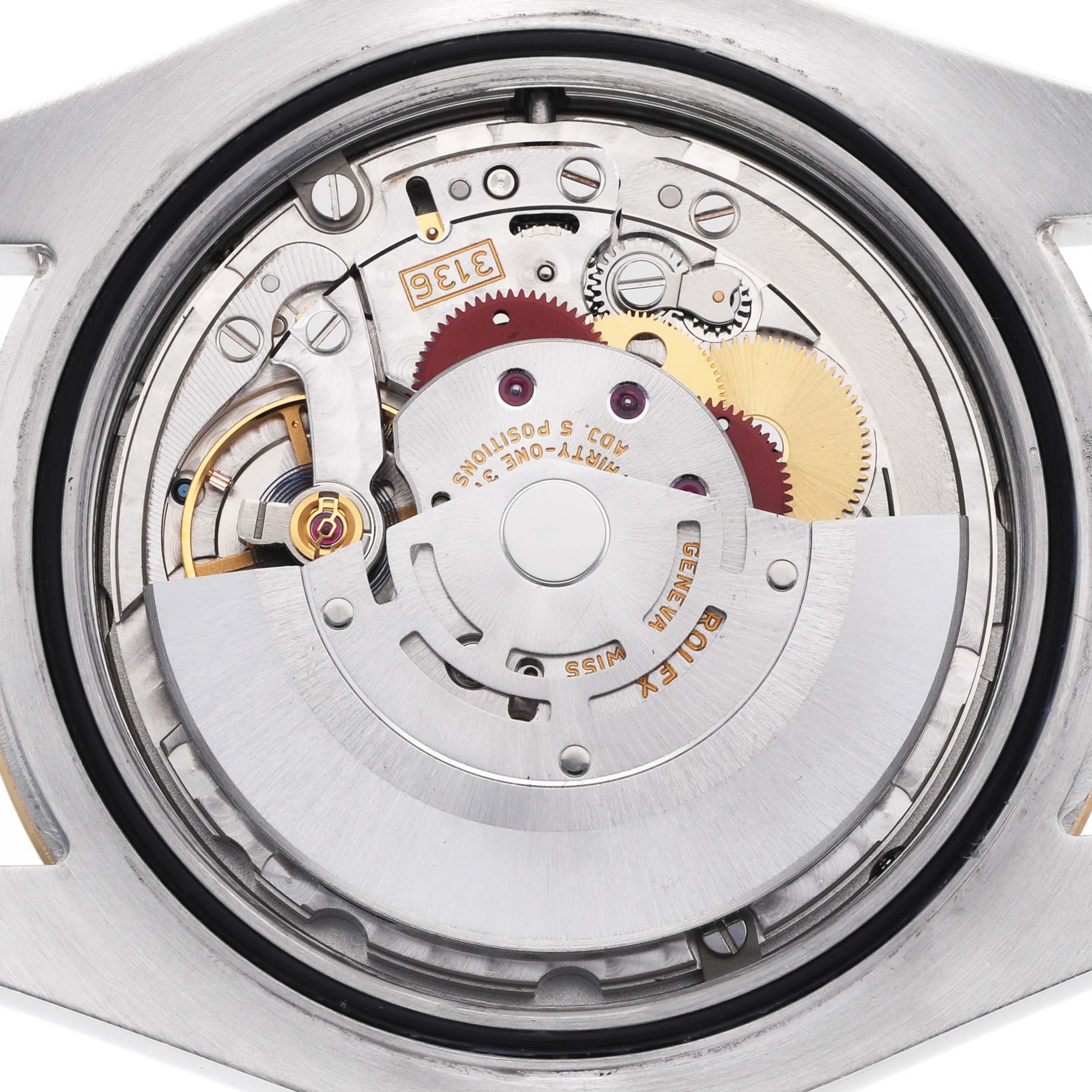 The image shows the movement mechanism of a Rolex Datejust 41 116333 Men's Steel and Gold (two tone) Champagne Dial, viewed from the back, highlighting gears and components.