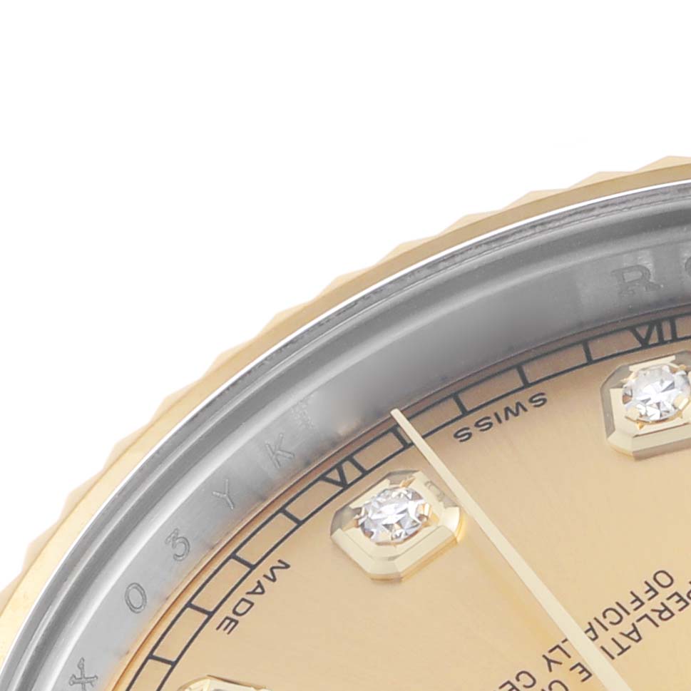 The image shows a partial close-up of the Rolex Datejust 41 116333 Men's Steel and Gold (two tone) Champagne Dial's diamond hour markers, hands, and fluted bezel.