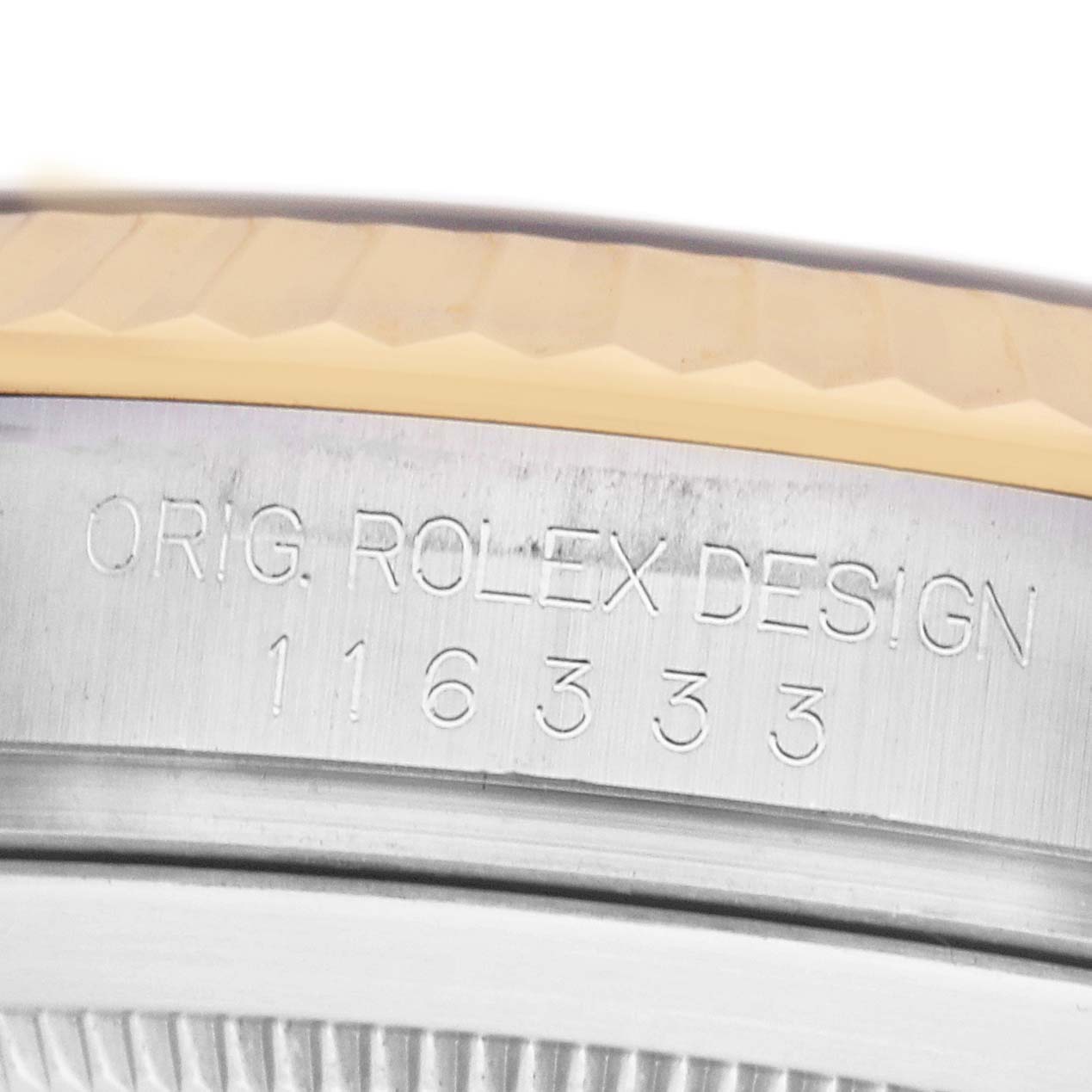 The image shows a close-up of the side engraving on the bezel of a Rolex Datejust 41 116333 Men's Steel and Gold (two tone) Champagne Dial, featuring the model number.
