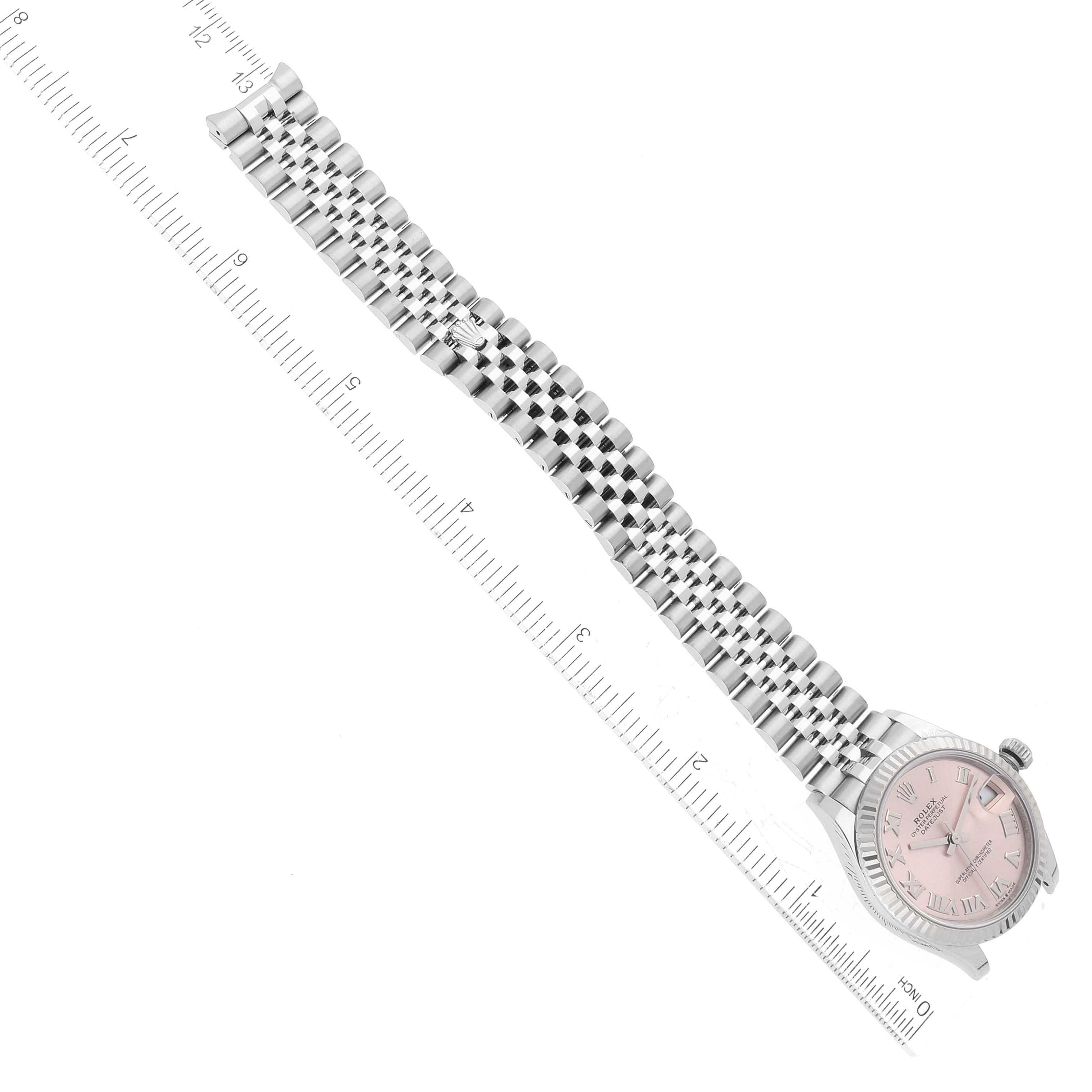 The image shows a Rolex Mid-Size 278274 Women's Stainless Steel Pink Dial 278274 Women's Stainless Steel Pink Dial watch with a pink dial and stainless steel bracelet, laid flat next to a ruler for measurement.