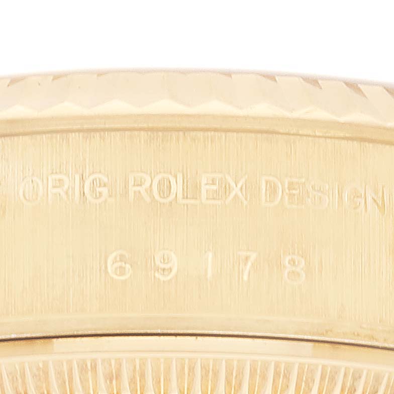 This image shows a close-up of the side of a Rolex President 69178 Women
s Yellow Gold Champagne Dial 69178 Women
s Yellow Gold Champagne Dial model, highlighting the "Orig Rolex Design" inscription and the model number.