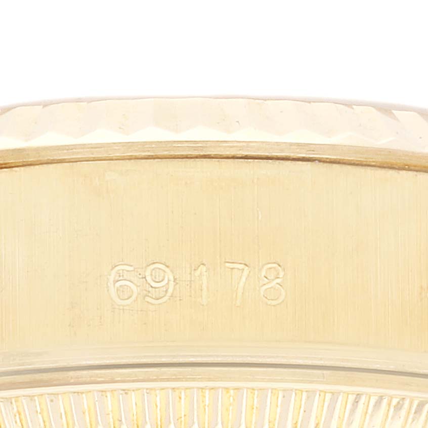 The image shows a close-up of the gold case and model number 69178 of a Rolex President 69178G Women's Yellow Gold Champagne Dial 69178G Women's Yellow Gold Champagne Dial watch.