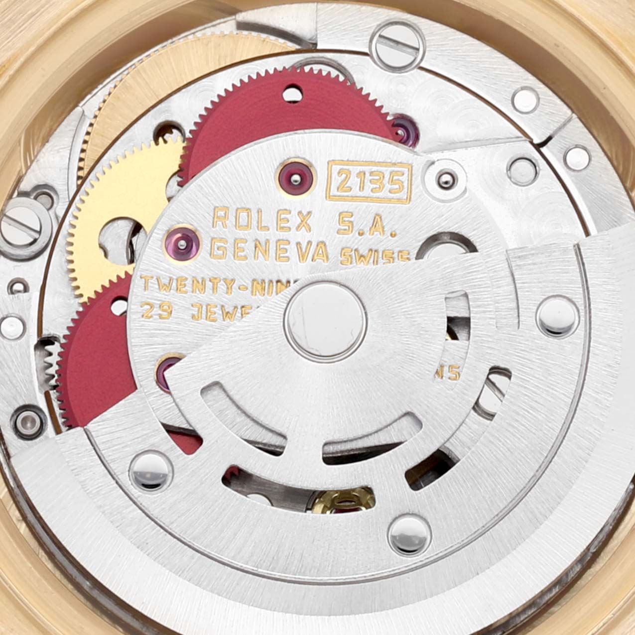 The image shows the internal mechanism of a Rolex President 69178 Women's Yellow Gold Champagne Dial 69178 Women's Yellow Gold Champagne Dial model watch, highlighting the gears and movement components.