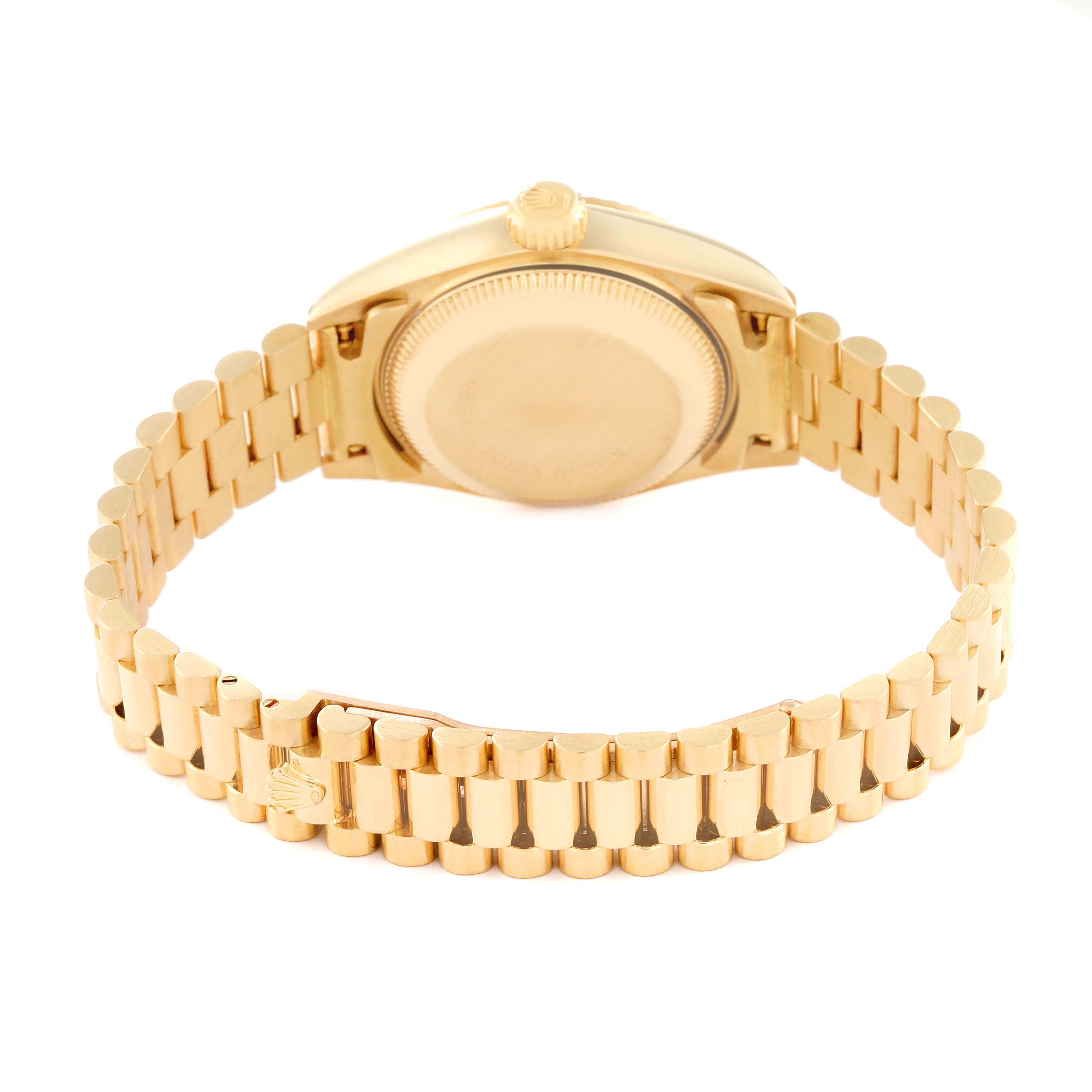 This image shows the back view of a Rolex President 69178 Women's Yellow Gold Champagne Dial 69178 Women's Yellow Gold Champagne Dial model watch, including the case back and gold bracelet.