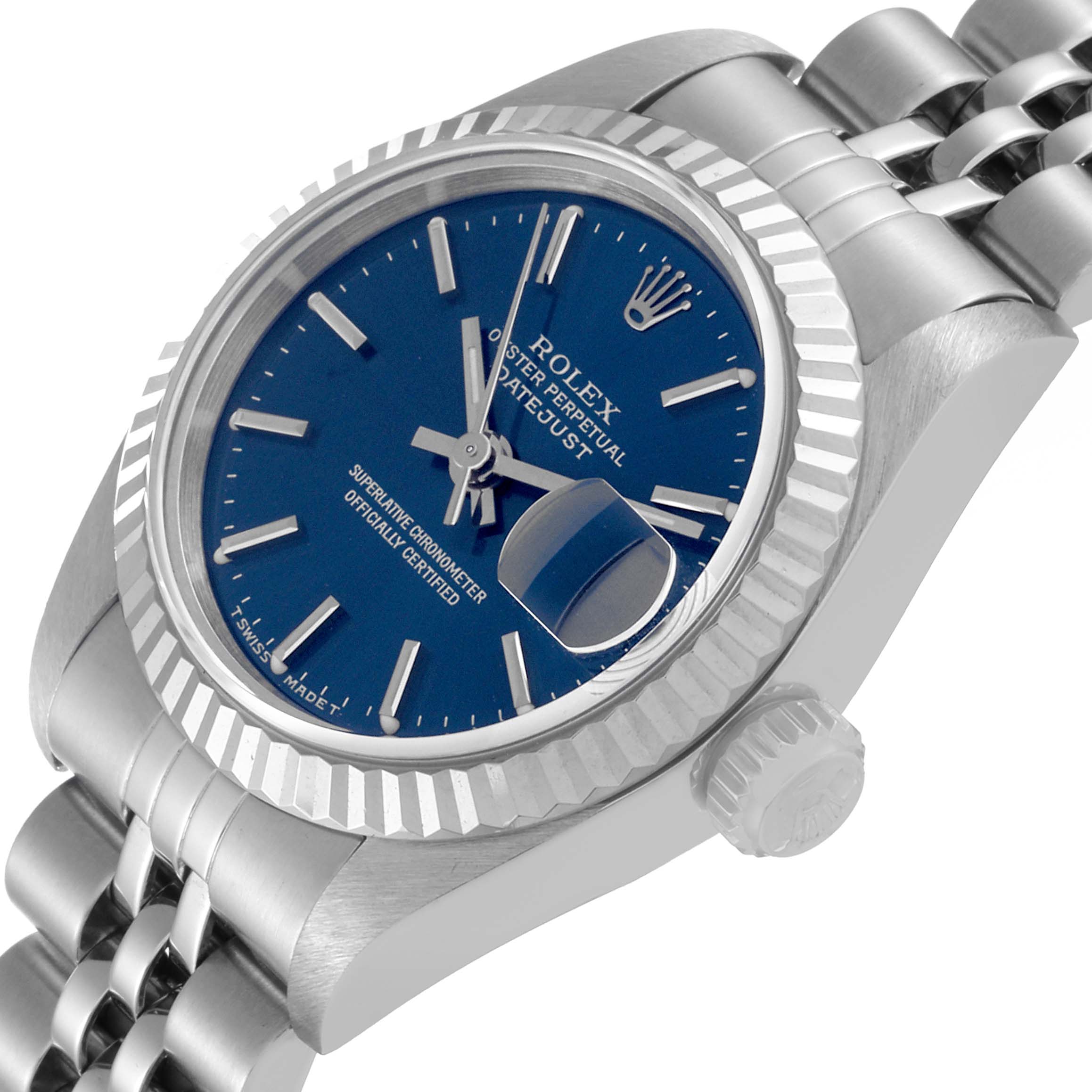 The image shows a Rolex Datejust 69174 Women's Stainless Steel Blue Dial 69174 Women's Stainless Steel Blue Dial with a blue dial and fluted bezel, viewed from an angled perspective highlighting the crown and bracelet.