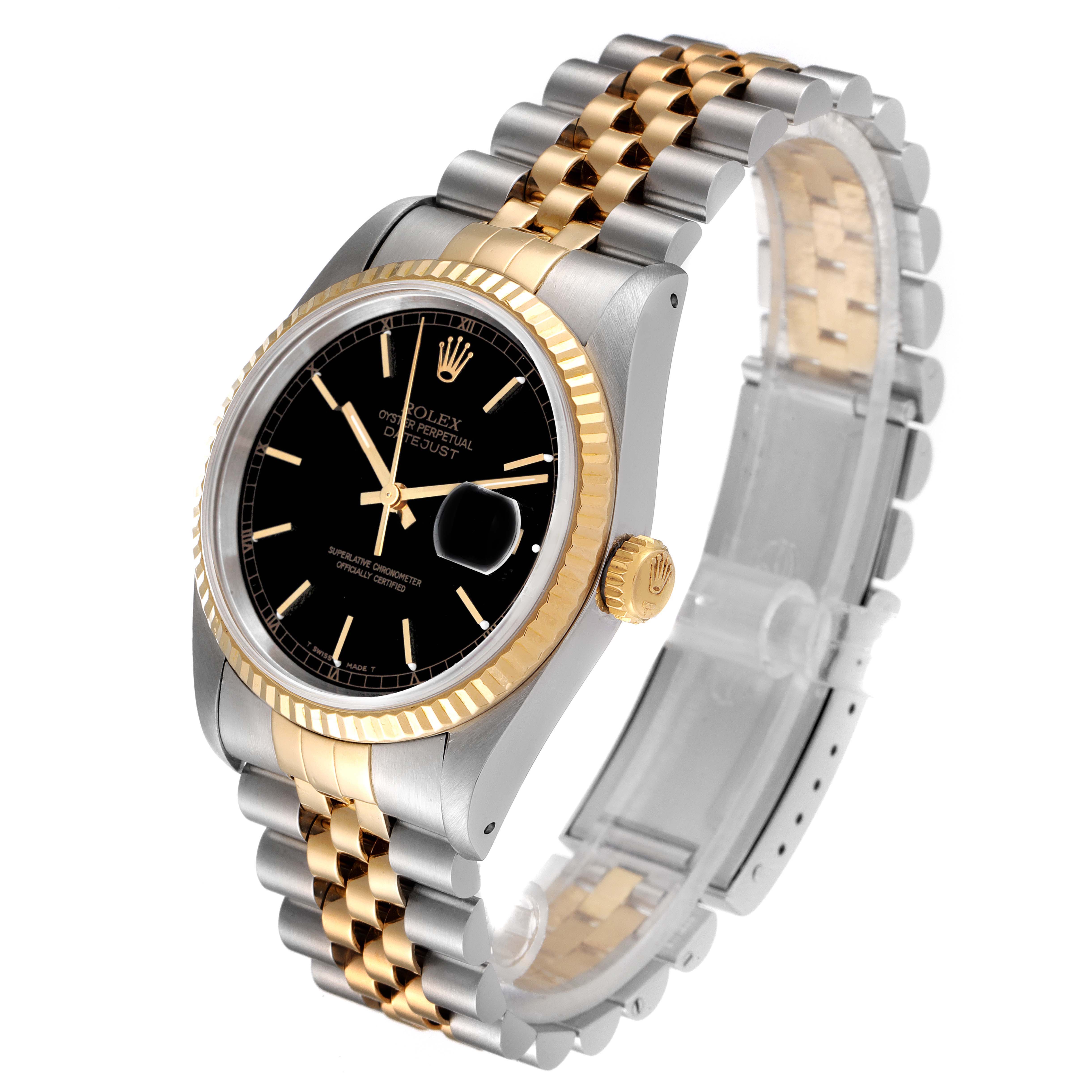This image shows a Rolex Datejust 16233 Men's Steel and Gold (two tone) Black Dial 16233 Men's Steel and Gold (two tone) Black Dial watch at a 3/4 angle, highlighting its black dial, fluted bezel, and two-tone bracelet.