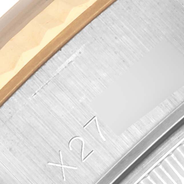 The image shows a close-up of the side of a Rolex Datejust 69173 Women's Steel and Gold (two tone) Black Dial 69173 Women's Steel and Gold (two tone) Black Dial watch, focusing on the engraving on its metal casing.