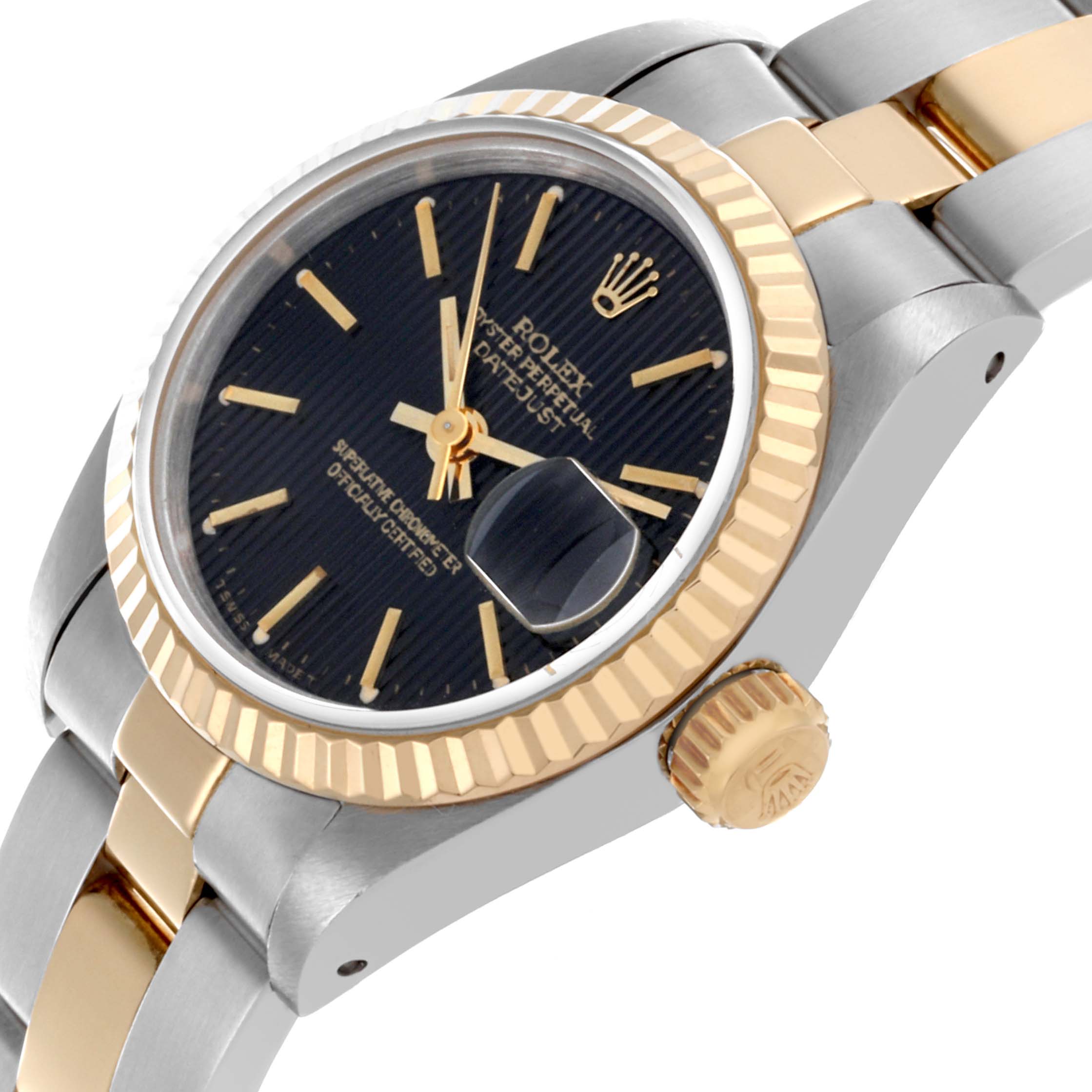 The Rolex Datejust 69173 Women's Steel and Gold (two tone) Black Dial 69173 Women's Steel and Gold (two tone) Black Dial watch is shown at an angle highlighting the dial, bezel, crown, and part of the bracelet.