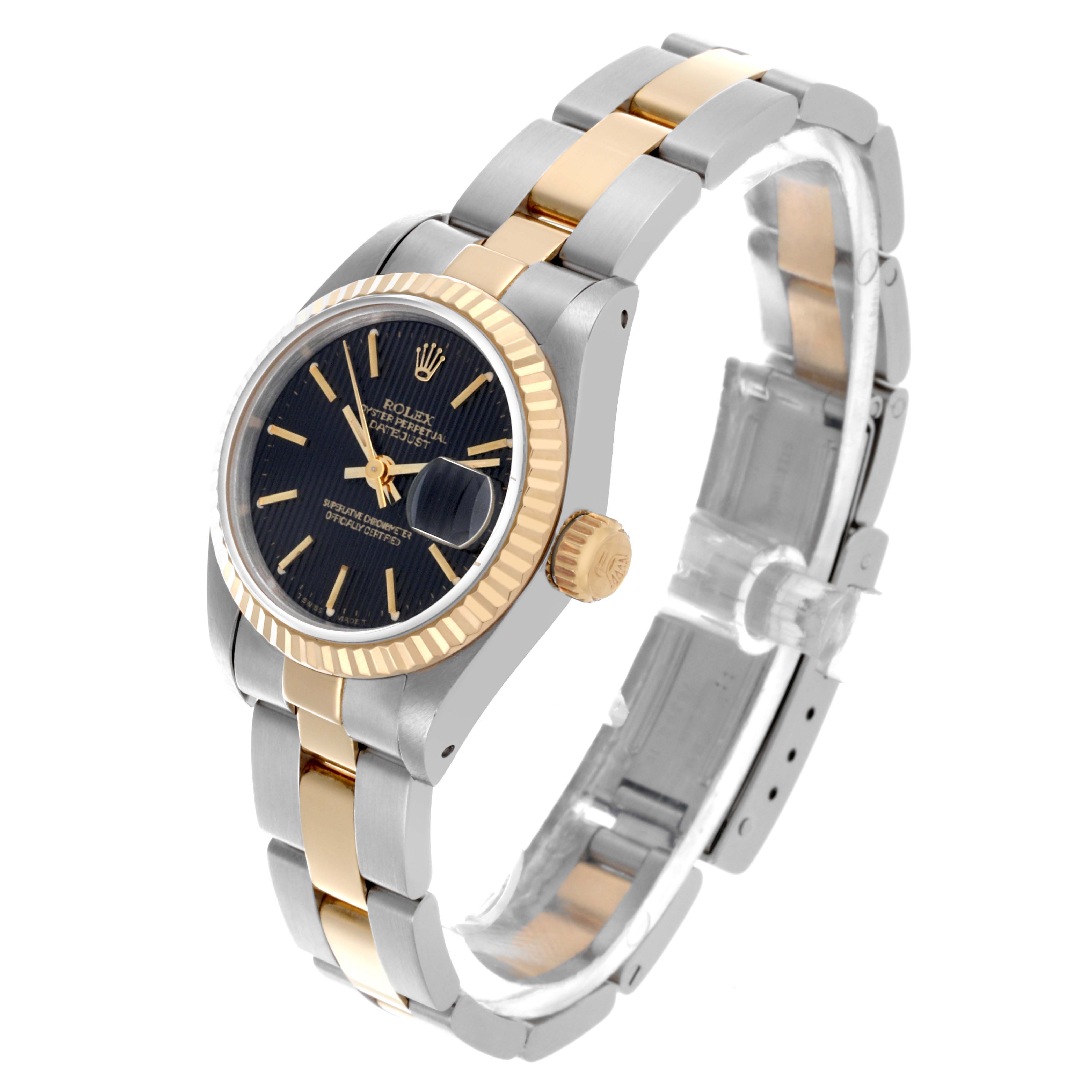 The Rolex Datejust 69173 Women's Steel and Gold (two tone) Black Dial 69173 Women's Steel and Gold (two tone) Black Dial watch is shown at a 3/4 angle, displaying its black dial, fluted bezel, and two-tone bracelet.