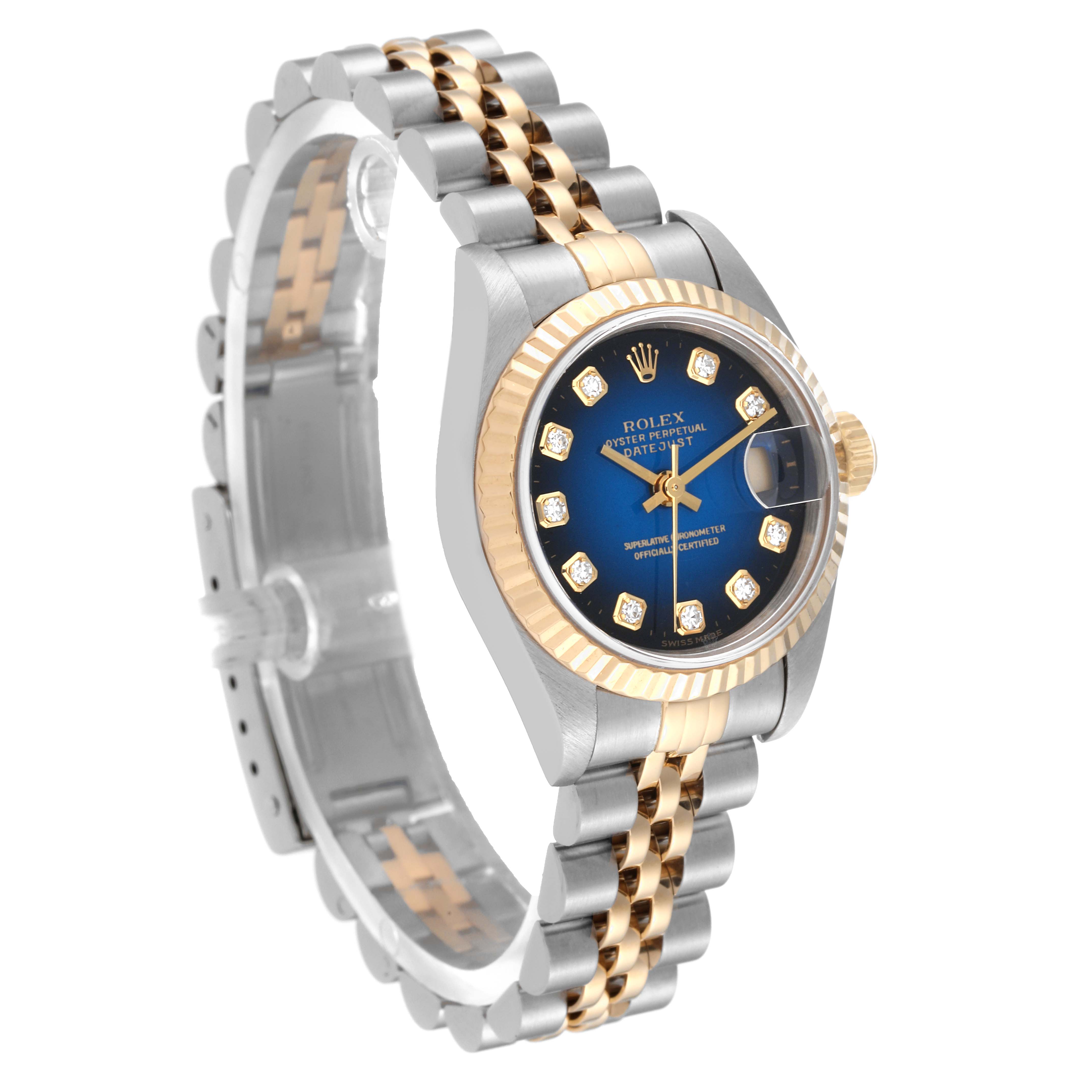 The image shows a Rolex Datejust 79173 Women's Steel and Gold (two tone) Blue Dial 79173 Women's Steel and Gold (two tone) Blue Dial watch at an angle displaying the face, crown, and two-tone metal bracelet.