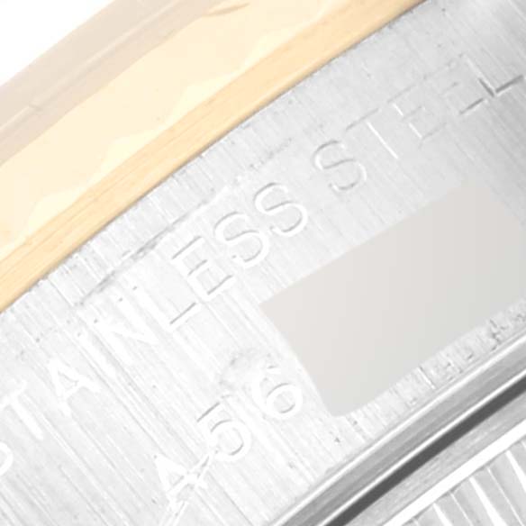 This close-up image shows the stainless steel casing and engravings on the edge of a Rolex Datejust 79173 Women's Steel and Gold (two tone) Blue Dial 79173 Women's Steel and Gold (two tone) Blue Dial watch.