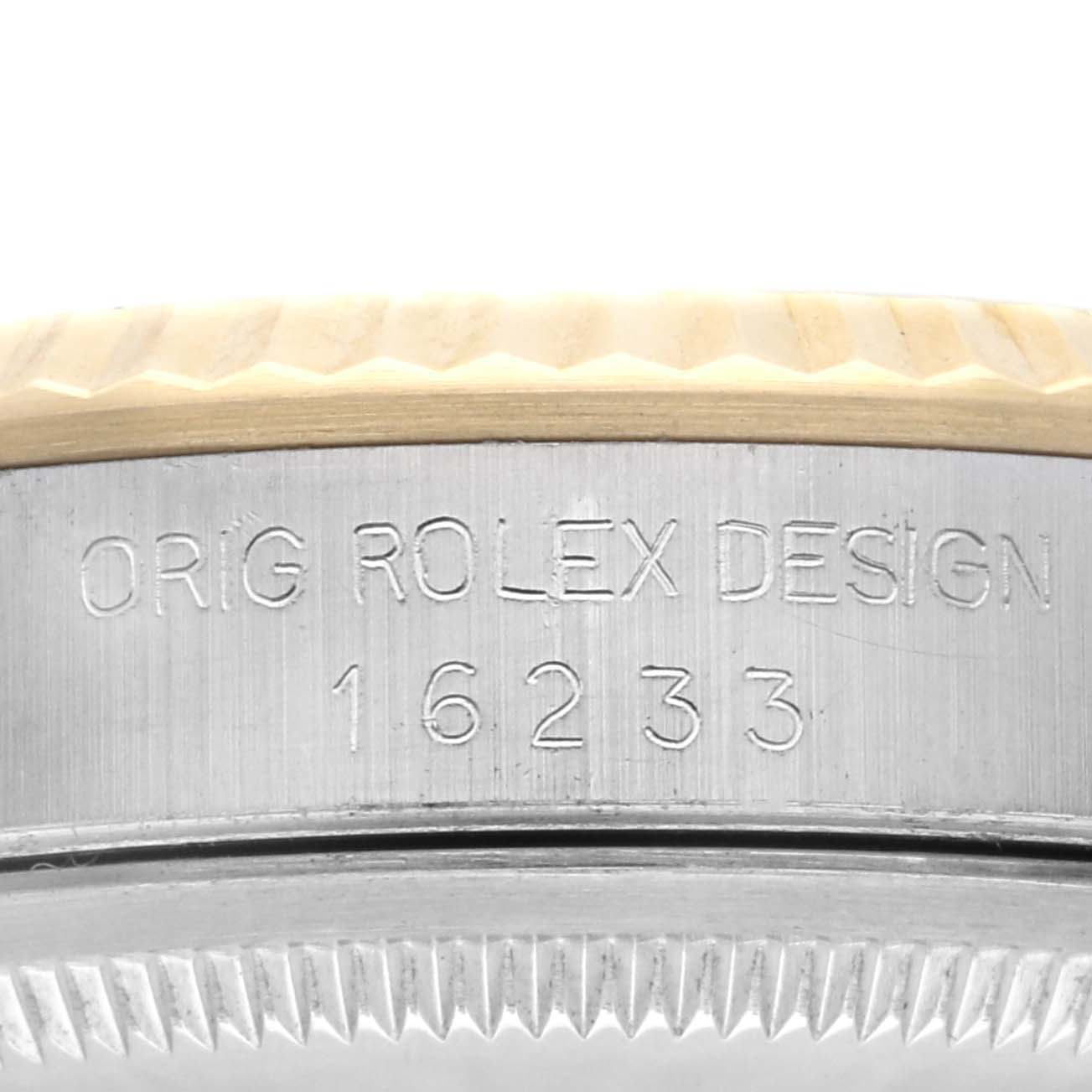 The image shows a close-up of the model number engraved on the case edge of a Rolex Datejust 16233 Men
s Steel and Gold (two tone) Champagne Dial 16233 Men
s Steel and Gold (two tone) Champagne Dial watch.