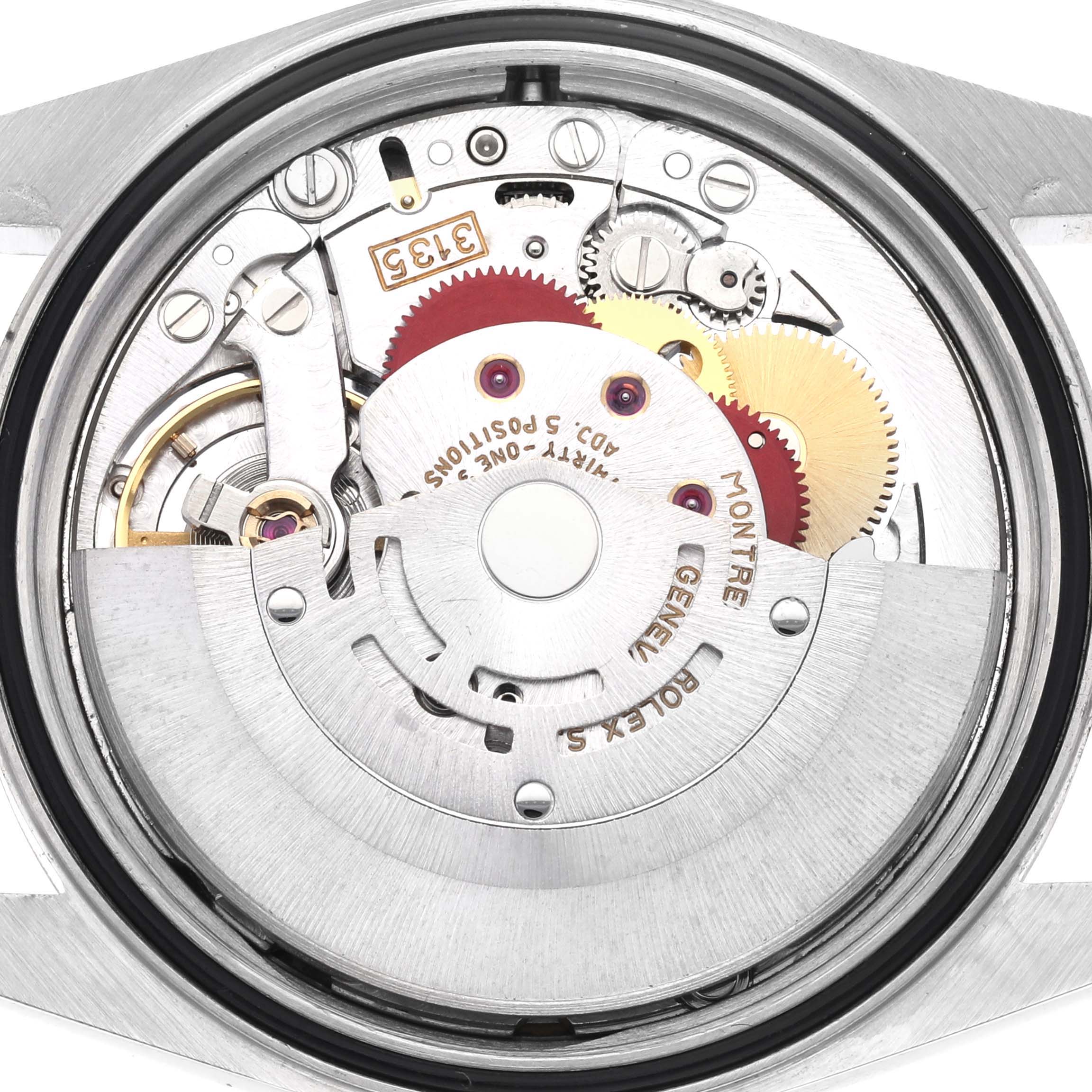 The image shows the detailed movement of the Rolex Datejust 16233 Men
s Steel and Gold (two tone) Champagne Dial 16233 Men
s Steel and Gold (two tone) Champagne Dial watch from a rear, open case perspective.