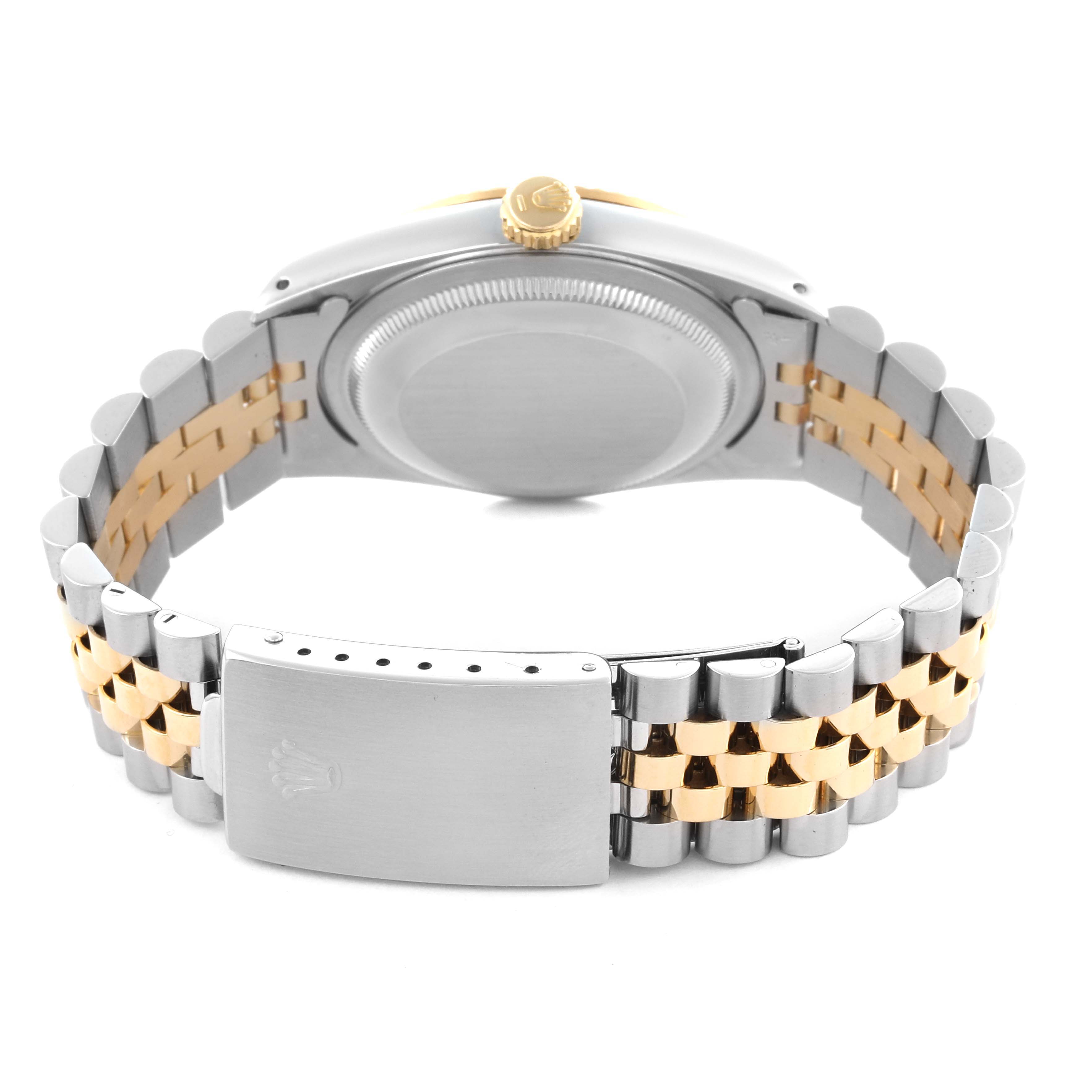 The Rolex Datejust 16233 Men
s Steel and Gold (two tone) Champagne Dial 16233 Men
s Steel and Gold (two tone) Champagne Dial is shown from the back, highlighting the bracelet, clasp, and case back.