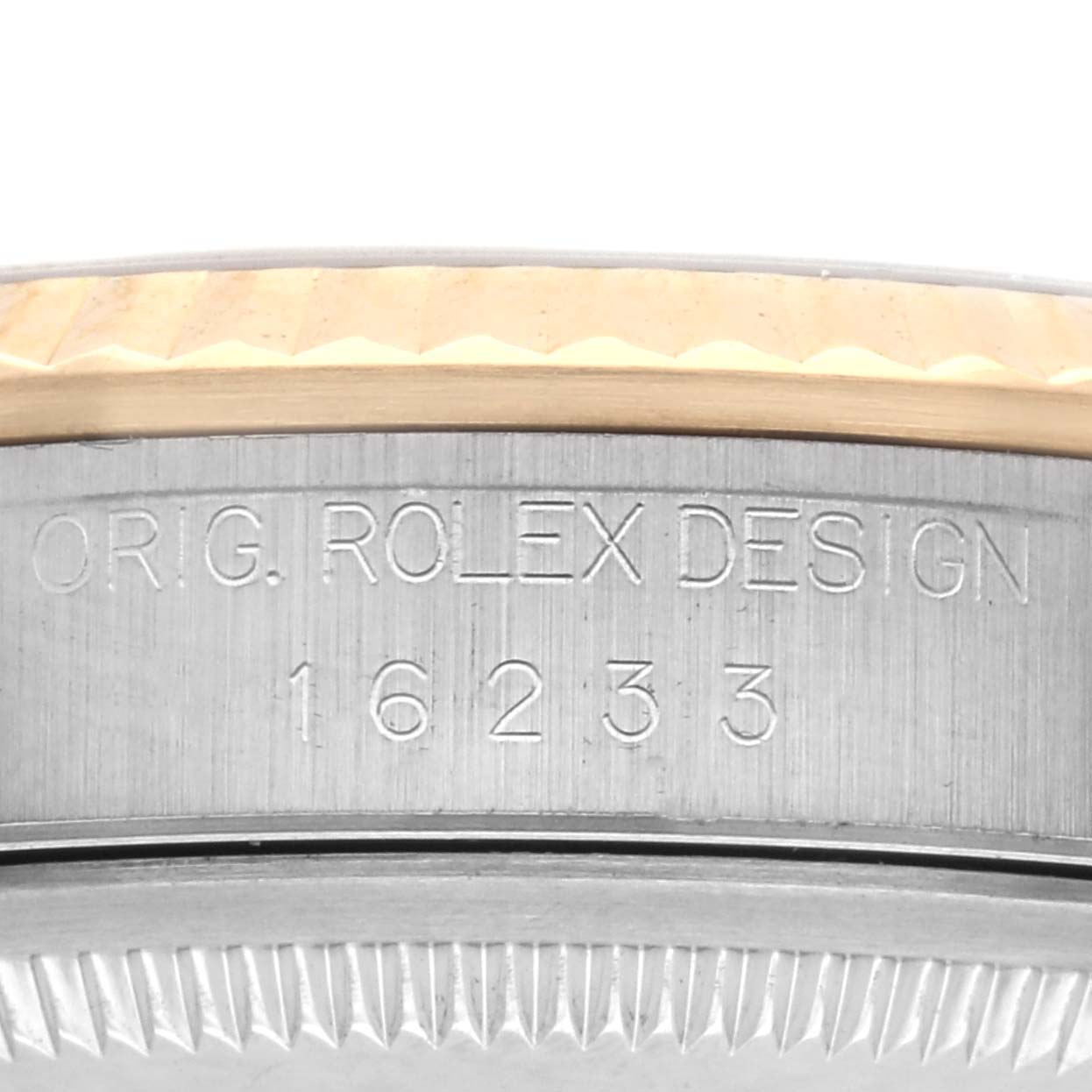 The image shows the side engraving of a Rolex Datejust 16233 Men's Steel and Gold (two tone) Champagne Dial 16233 Men's Steel and Gold (two tone) Champagne Dial, displaying "ORIG. ROLEX DESIGN 16233."