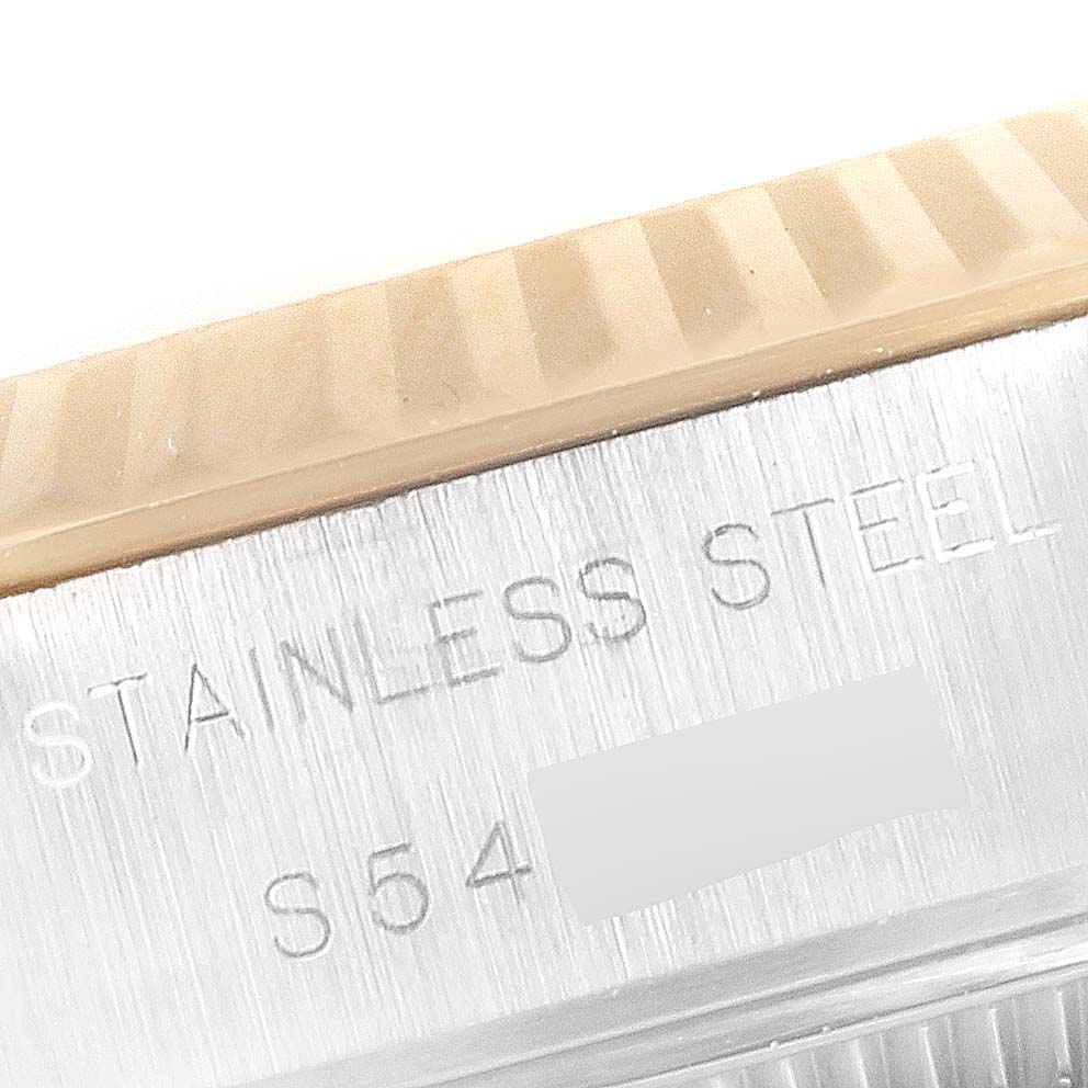 The image shows a close-up of the stainless steel case and fluted bezel of a Rolex Datejust 69173 Women's Steel and Gold (two tone) Champagne Dial 69173 Women's Steel and Gold (two tone) Champagne Dial model.