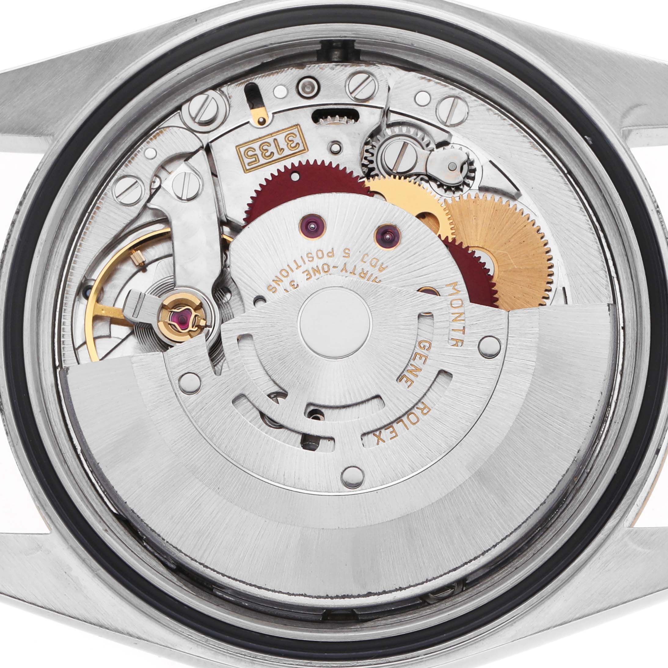 The image shows the movement and internal components of a Rolex Datejust 16233 Men's Steel and Gold (two tone) White Dial watch from a back angle with the case removed.