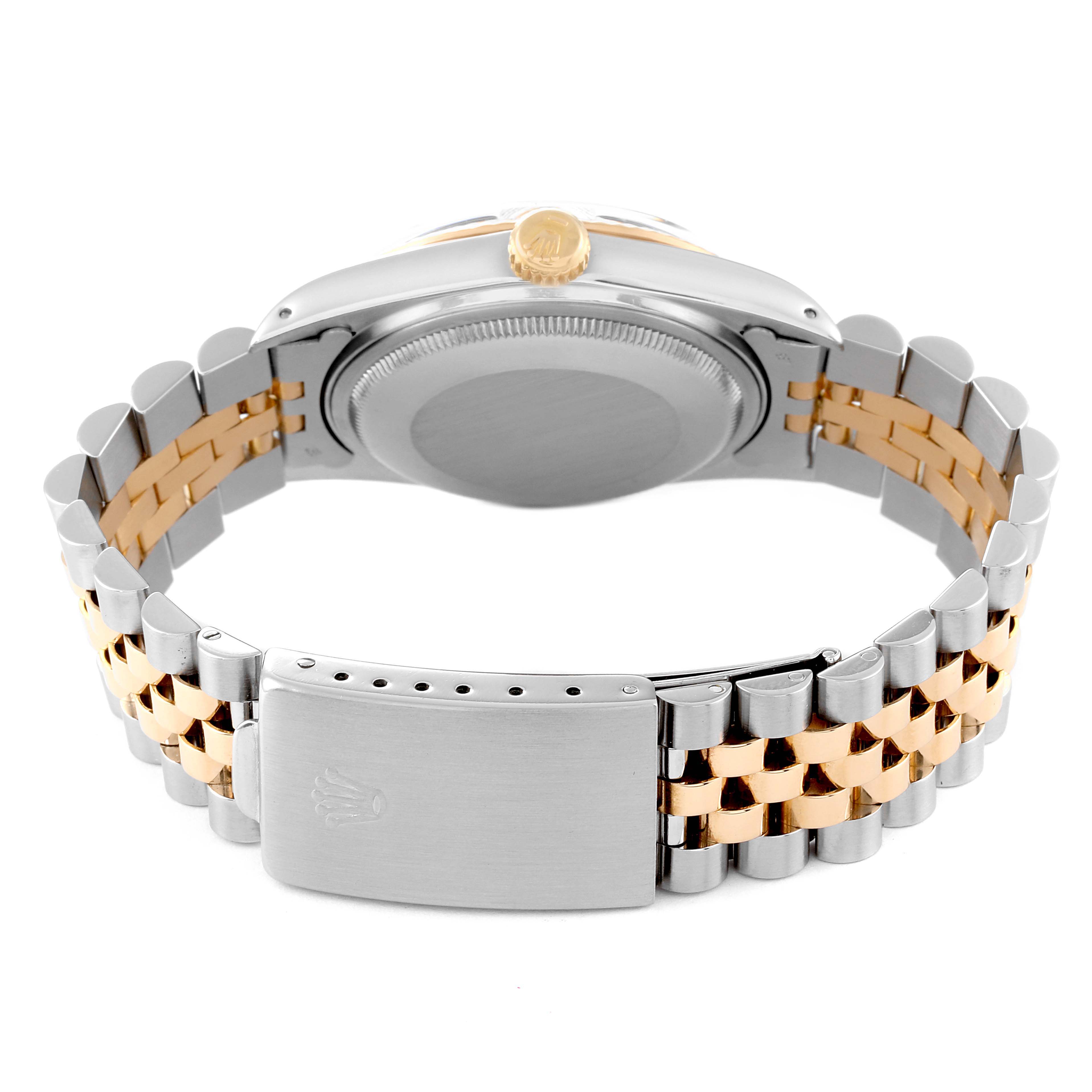 The image shows the back view of a Rolex Datejust 16013 Men's Steel and Gold (two tone) White Dial 16013 Men's Steel and Gold (two tone) White Dial watch, highlighting the case back, crown, and two-tone bracelet clasp.