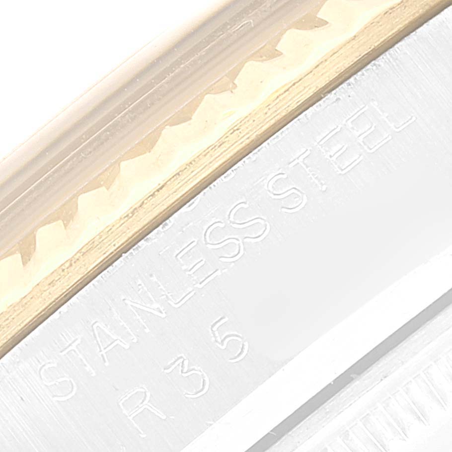 This close-up image shows the stainless steel side engraving on a Rolex Datejust 16013 Men's Steel and Gold (two tone) White Dial 16013 Men's Steel and Gold (two tone) White Dial watch.