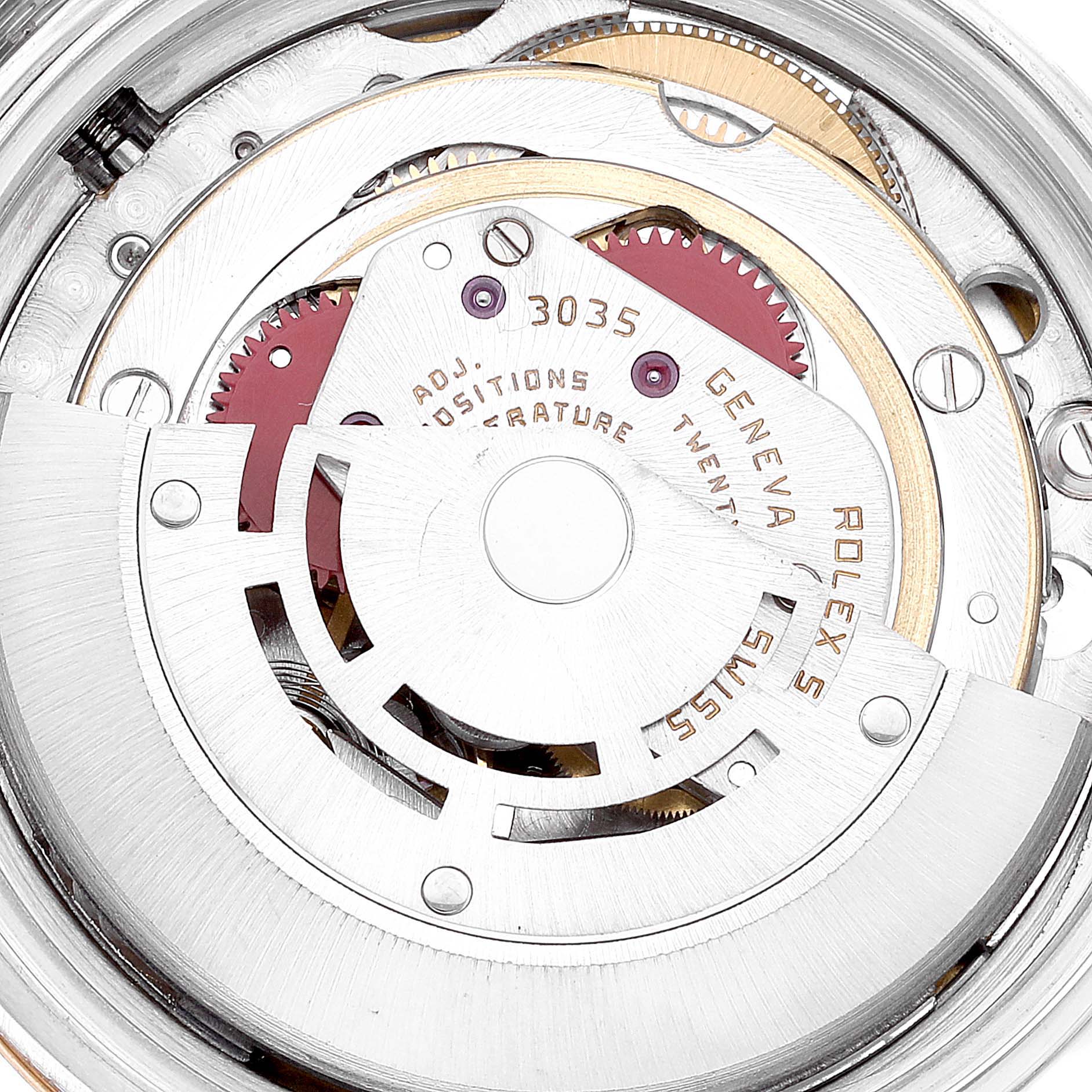 This image shows a close-up of the movement mechanism of a Rolex Datejust 16013 Men's Steel and Gold (two tone) White Dial 16013 Men's Steel and Gold (two tone) White Dial watch, highlighting gears and engravings.