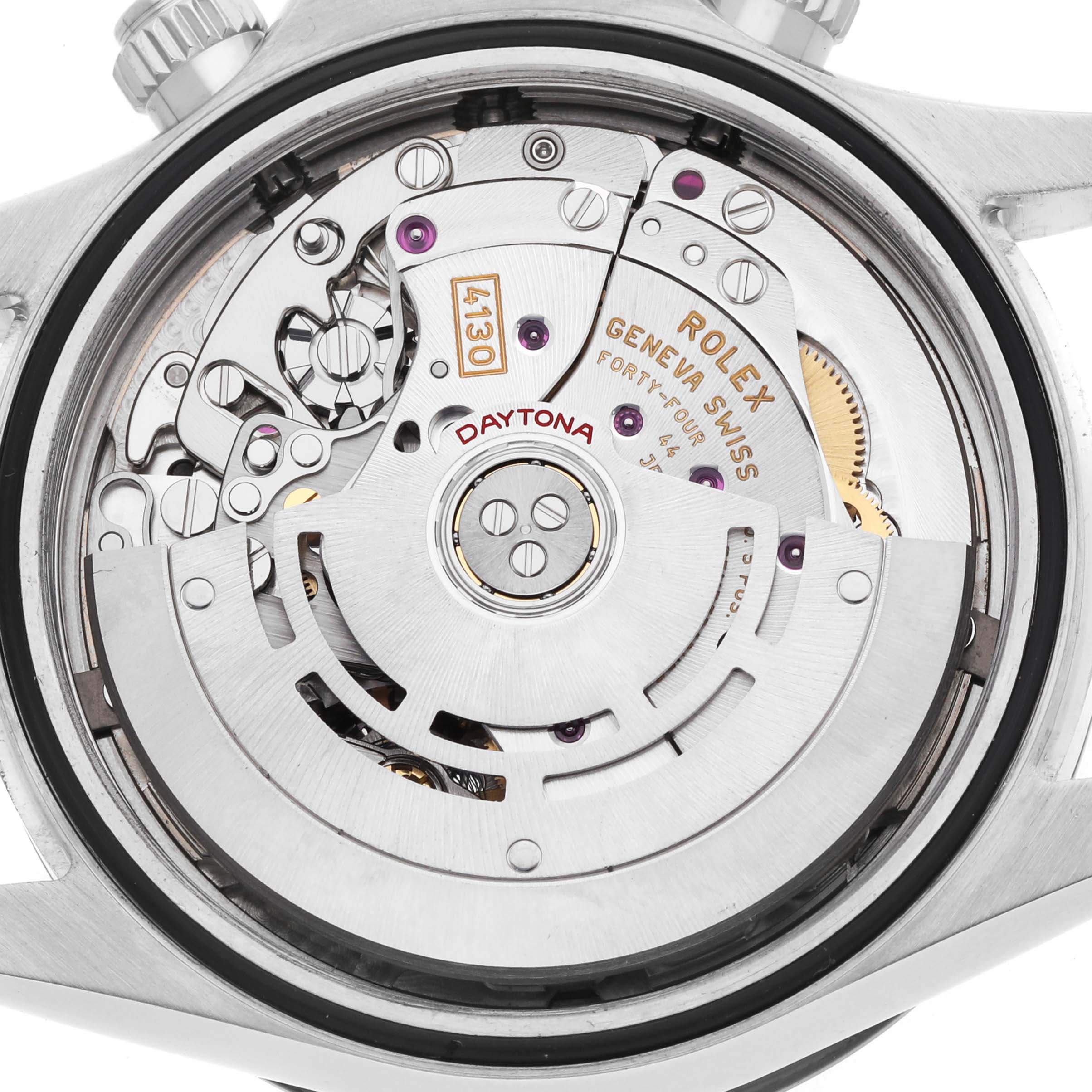 The image shows the movement of a Rolex Daytona 116500 Men's Stainless Steel White Dial, viewed from the back, highlighting the rotor and intricate components.