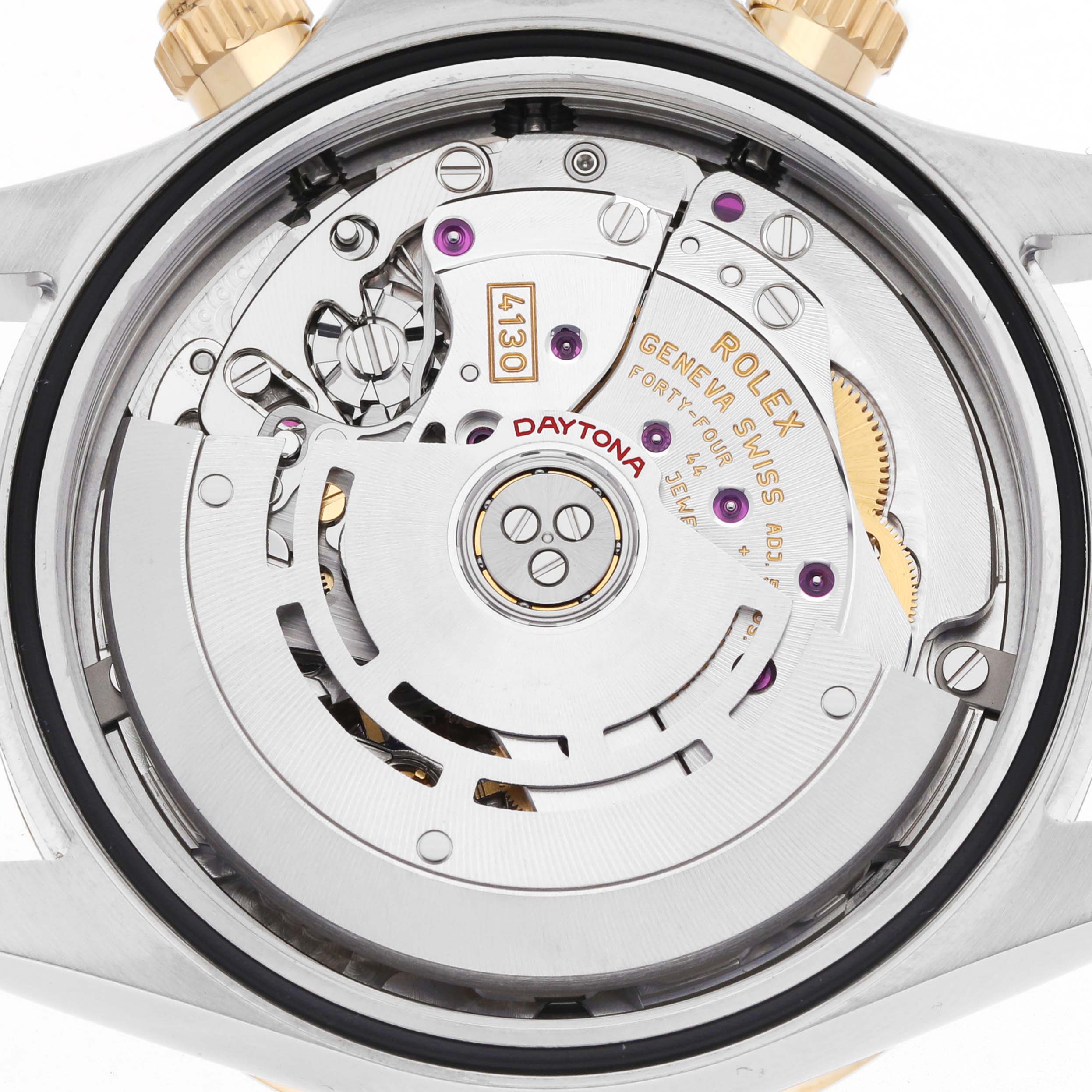 The image shows the Rolex Daytona 116503 Men's Steel and Gold (two tone) White Dial watch movement from the back, highlighting gears and engravings.