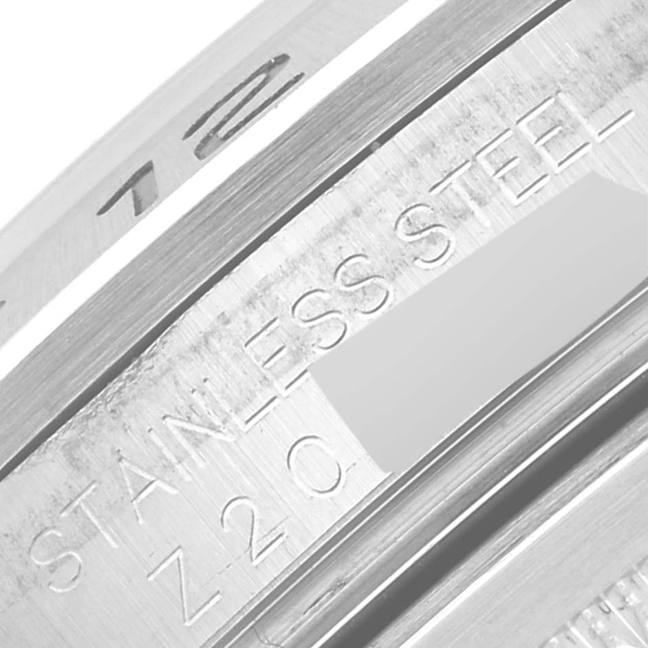 The image shows a close-up angle of the inner engraving on the Rolex Explorer 16570 Men's Stainless Steel White Dial's stainless steel case, highlighting text details.