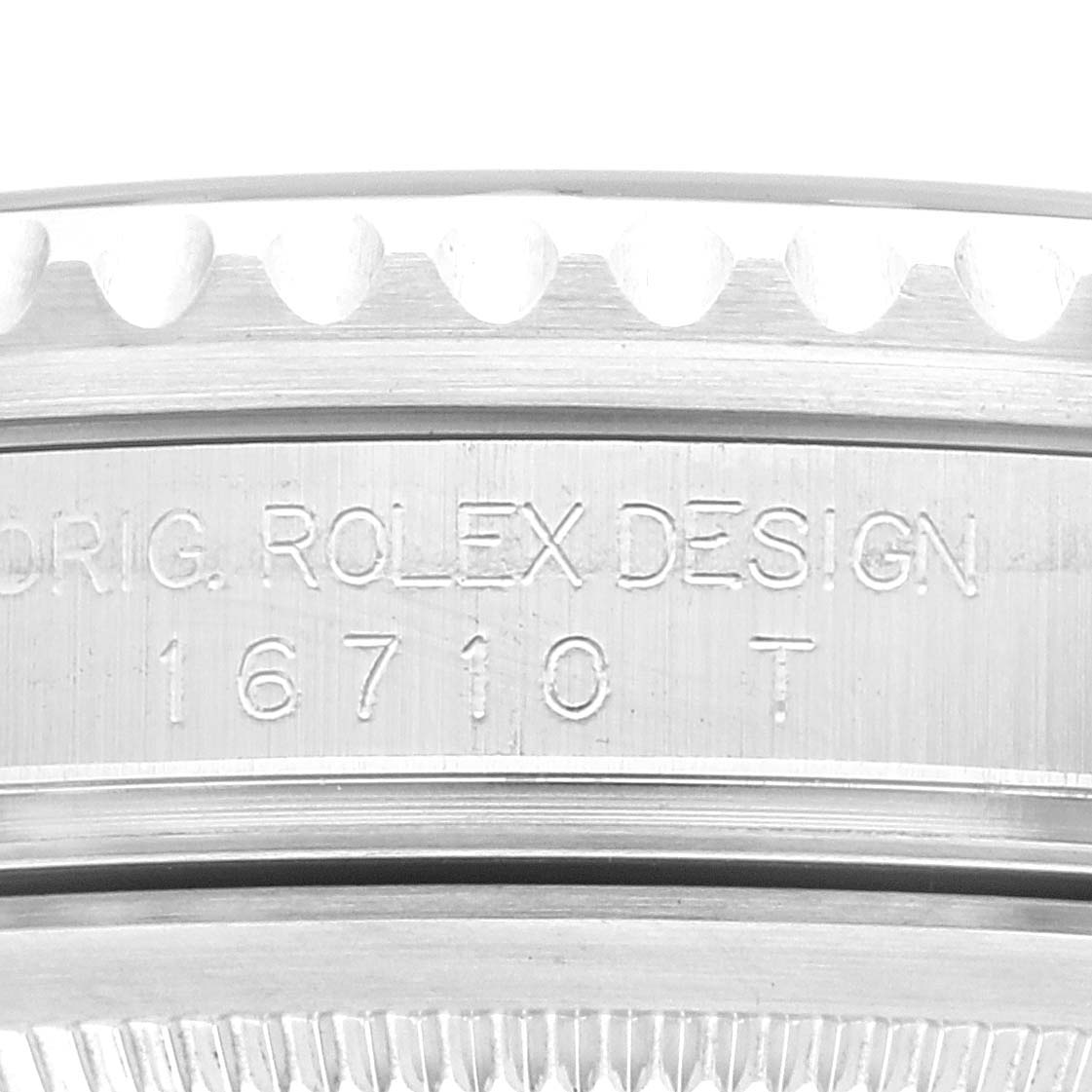 The image shows a close-up of the side of a Rolex GMT-Master 16710 Men's Stainless Steel Black Dial 16710 Men's Stainless Steel Black Dial watch case, displaying the model number 16710 and "ROLEX DESIGN" engraving.