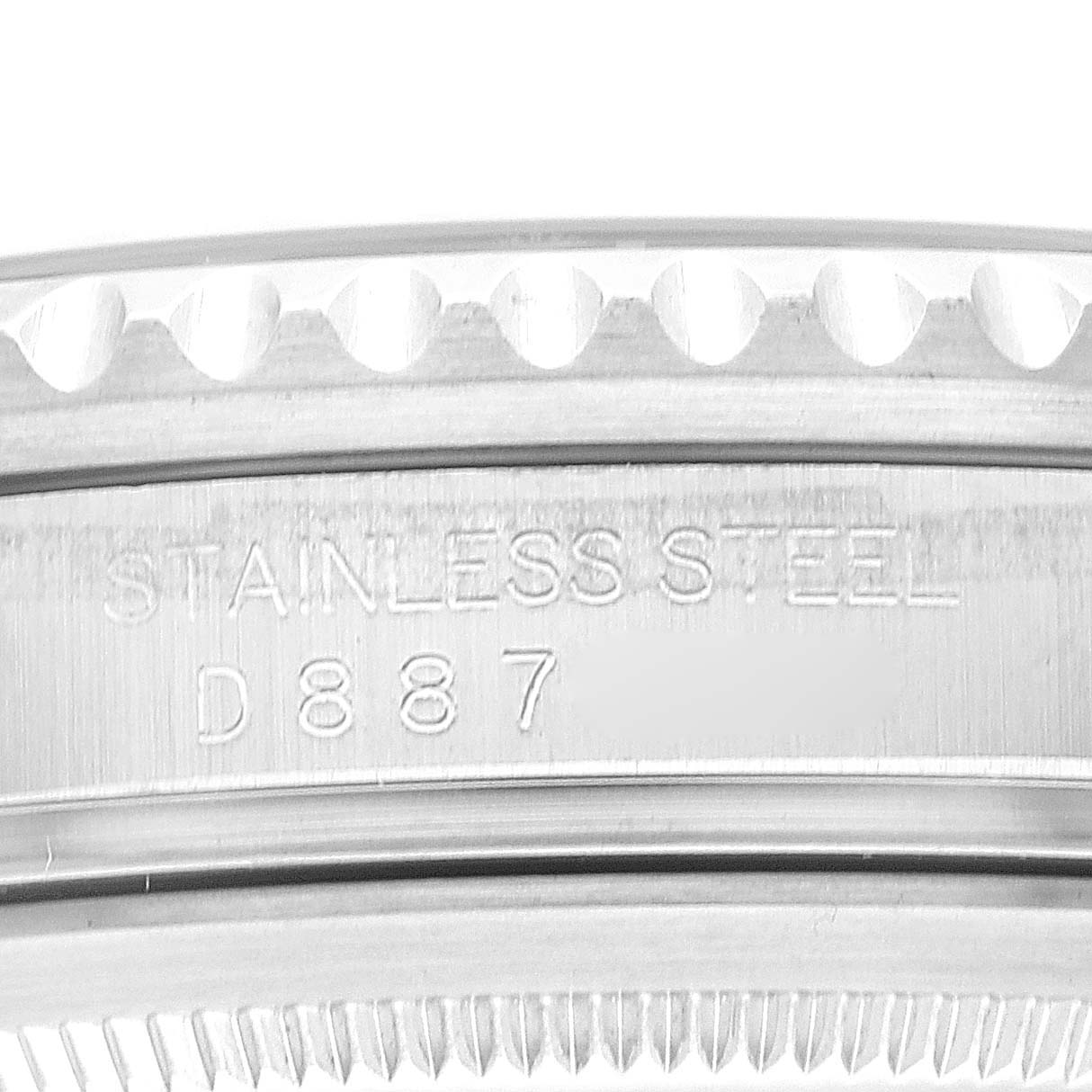 Close-up view of the side engraving and bezel of the Rolex GMT-Master 16710 Men's Stainless Steel Black Dial 16710 Men's Stainless Steel Black Dial, showing "STAINLESS STEEL" and the serial number.