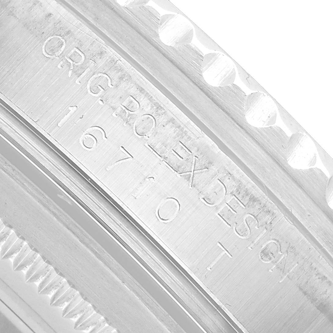 The image shows a close-up of the engraved rehaut on a Rolex GMT-Master 16710 Men's Stainless Steel Black Dial, displaying the model and brand details.