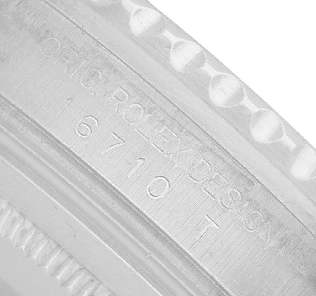 This image shows a close-up of the case side of a Rolex GMT-Master 16710 Men's Stainless Steel Black Dial, highlighting the engraved model number.