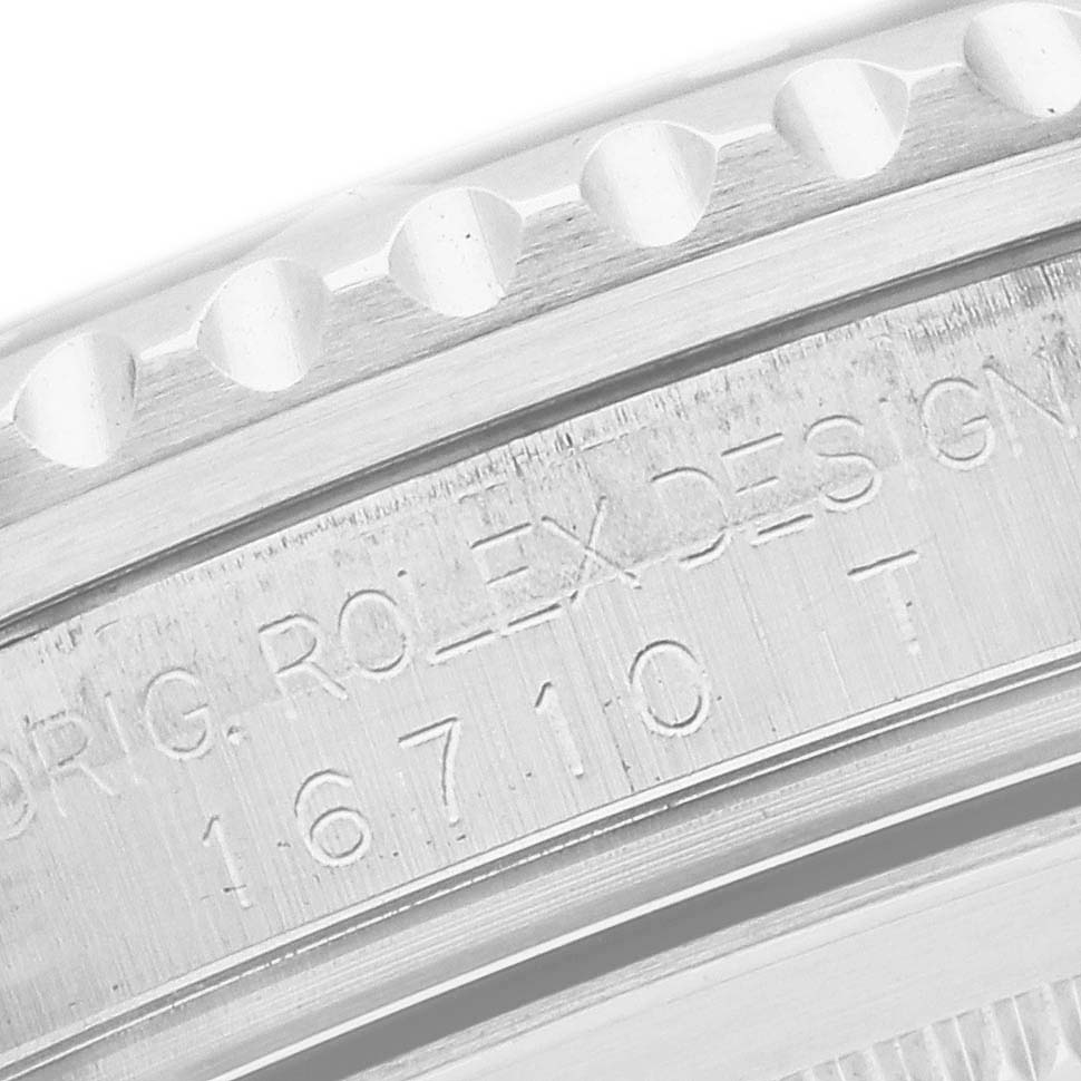 The image shows a close-up of the case side of a Rolex GMT-Master 16710 Men's Stainless Steel Black Dial, highlighting etched text and bezel edge details.