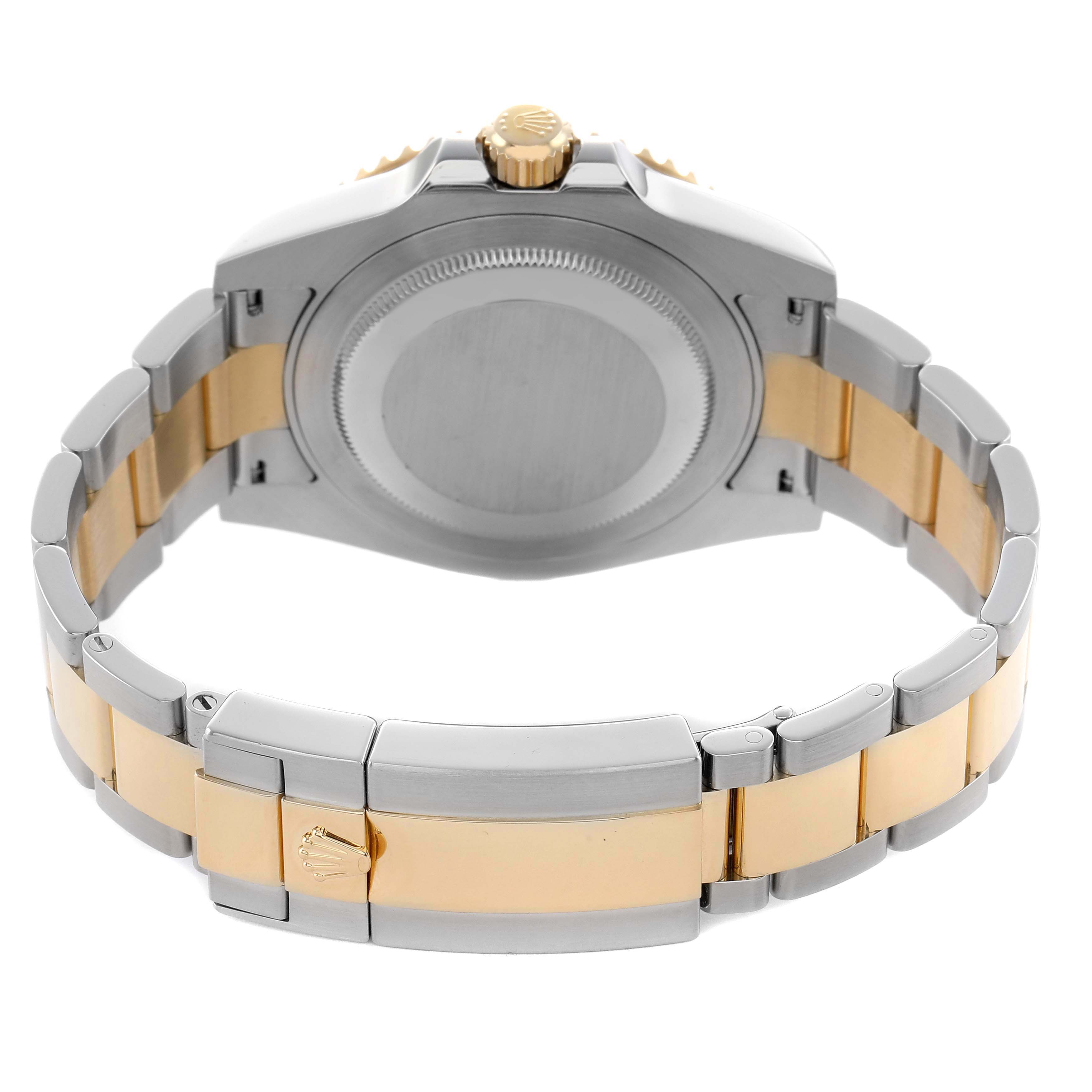 The image shows the back of a Rolex GMT-Master 116713 Men's Steel and Gold (two tone) Black Dial, highlighting the case, crown, and two-tone bracelet.