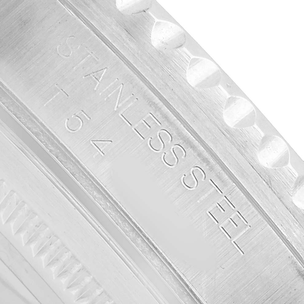 The image shows a close-up shot of the side of the Rolex GMT-Master 16700 Men's Stainless Steel Black Dial, focusing on the engraved stainless steel bezel with text.