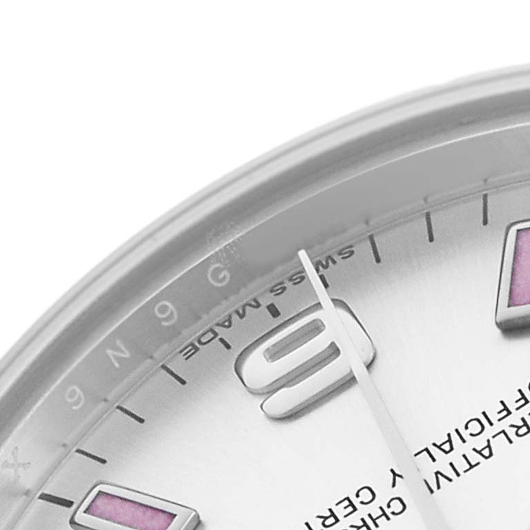 The image shows a close-up of the Rolex Mid-Size 177200 Women's Stainless Steel Silver Dial watch face, highlighting the 9 o'clock marker, part of the dial, and the hands.