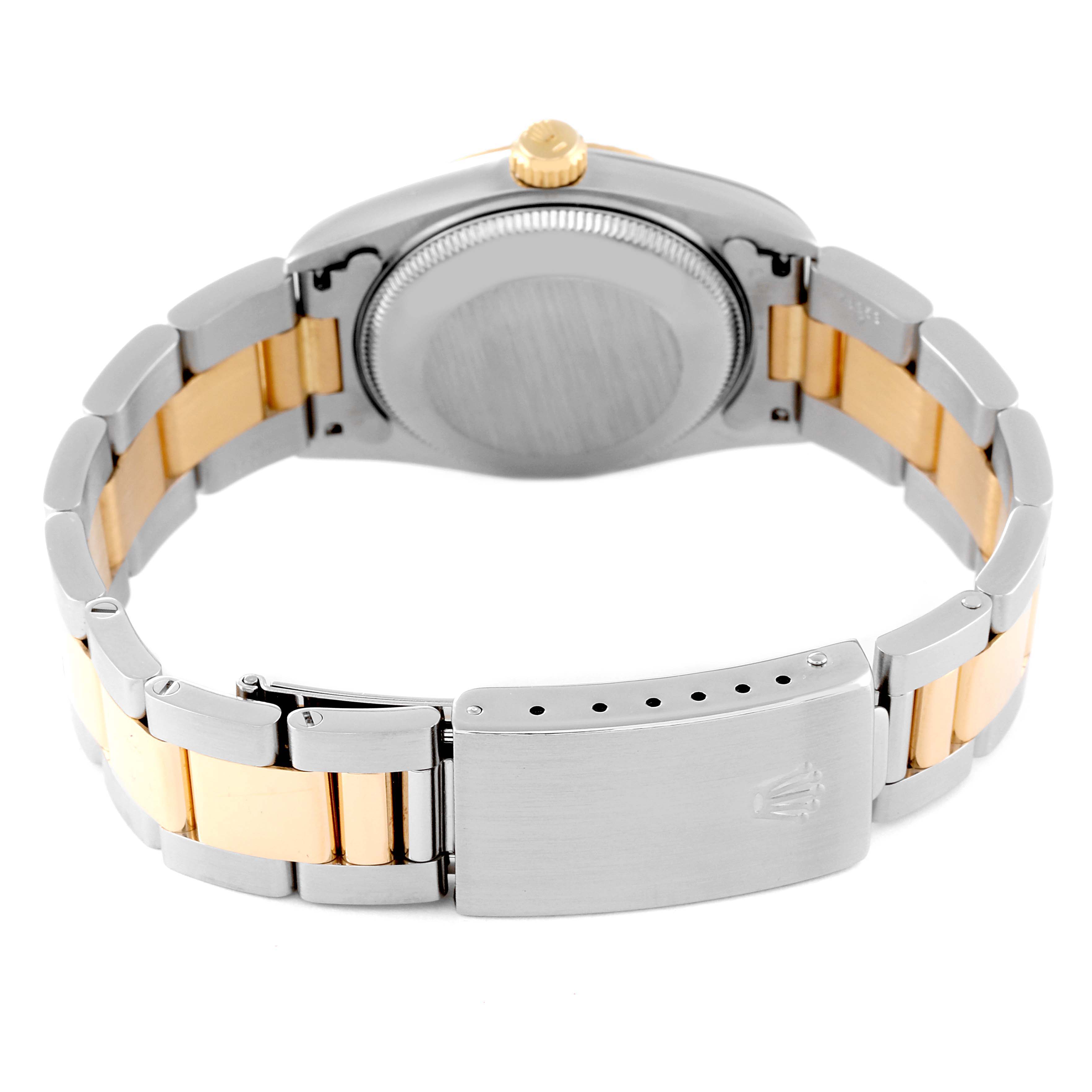 The image shows the back view of a Mid-Size Rolex watch, highlighting the case back, bracelet, and clasp.