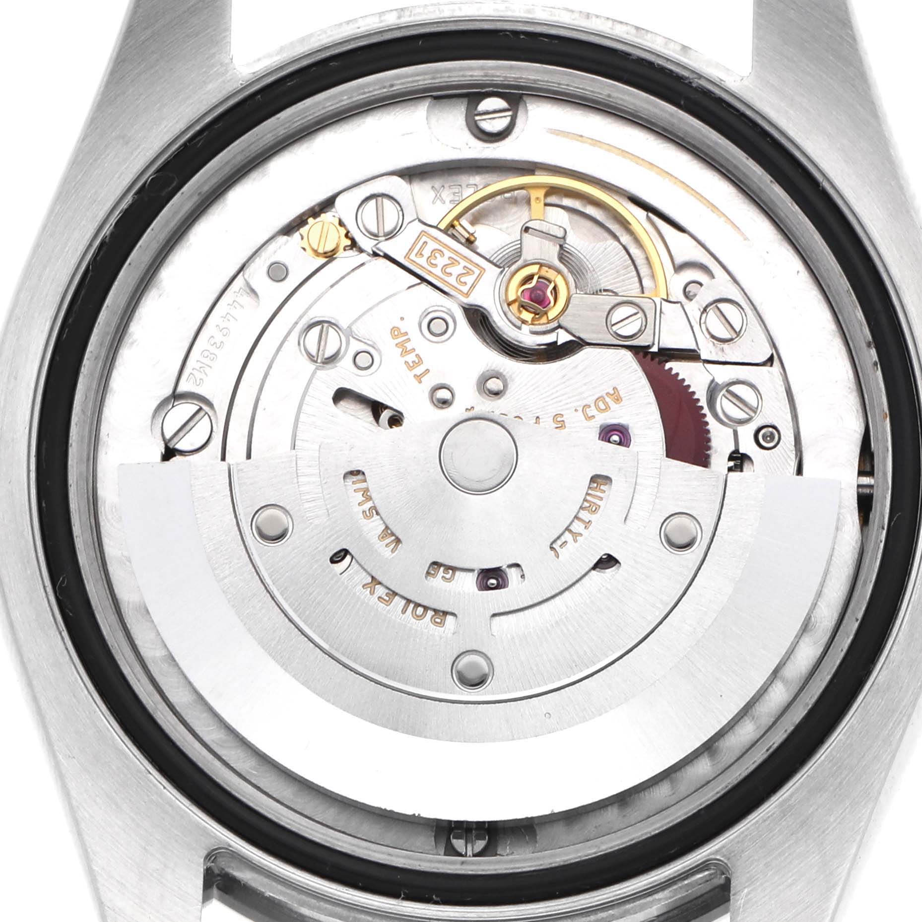 The image shows the internal mechanism of a Rolex Mid-Size 177200 Women's Stainless Steel Black Dial watch from the back, featuring the rotor and movement components.