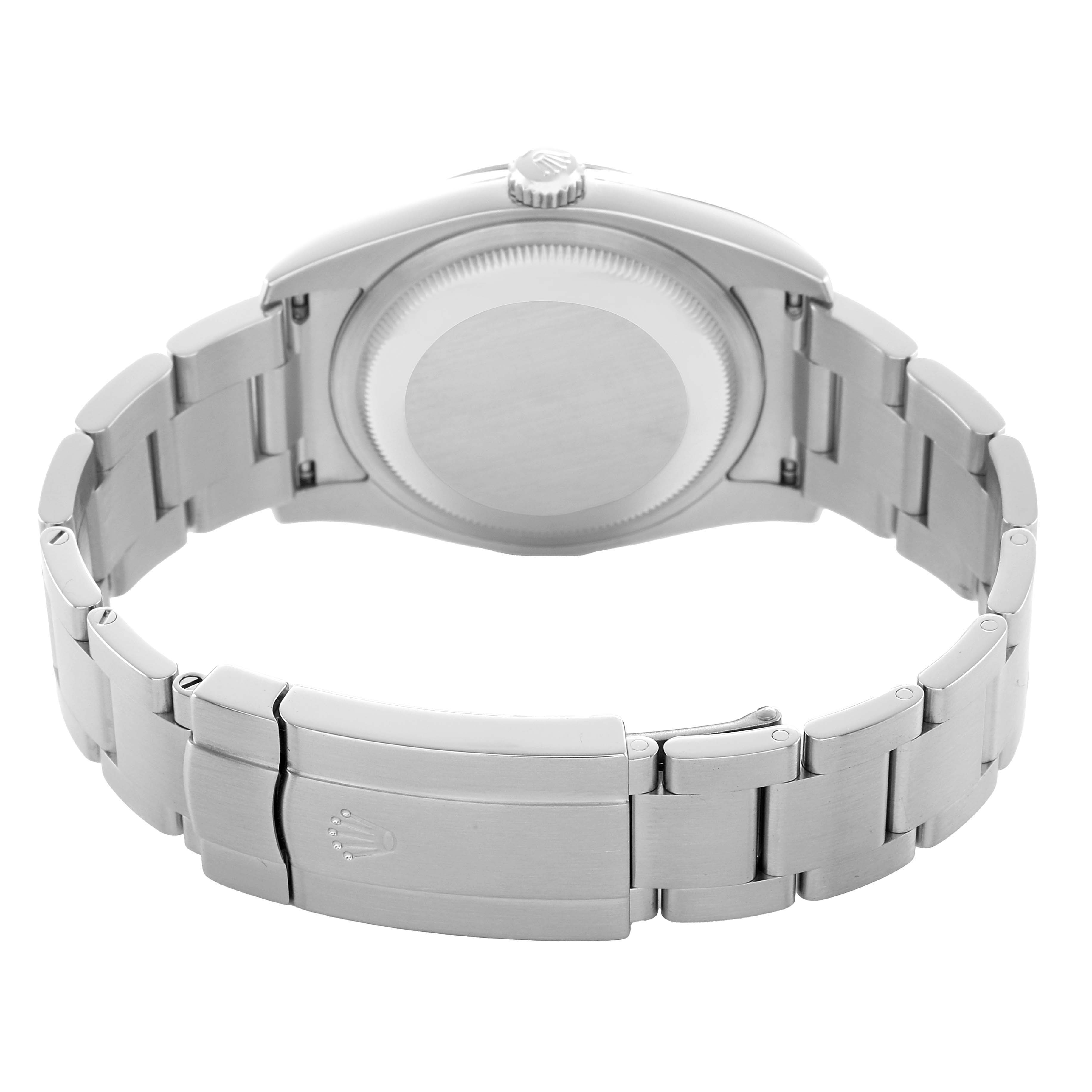 The image shows the back view of a Rolex Oyster Perpetual 116000 Men's Stainless Steel Silver Dial, highlighting the case back and metal bracelet with clasp.