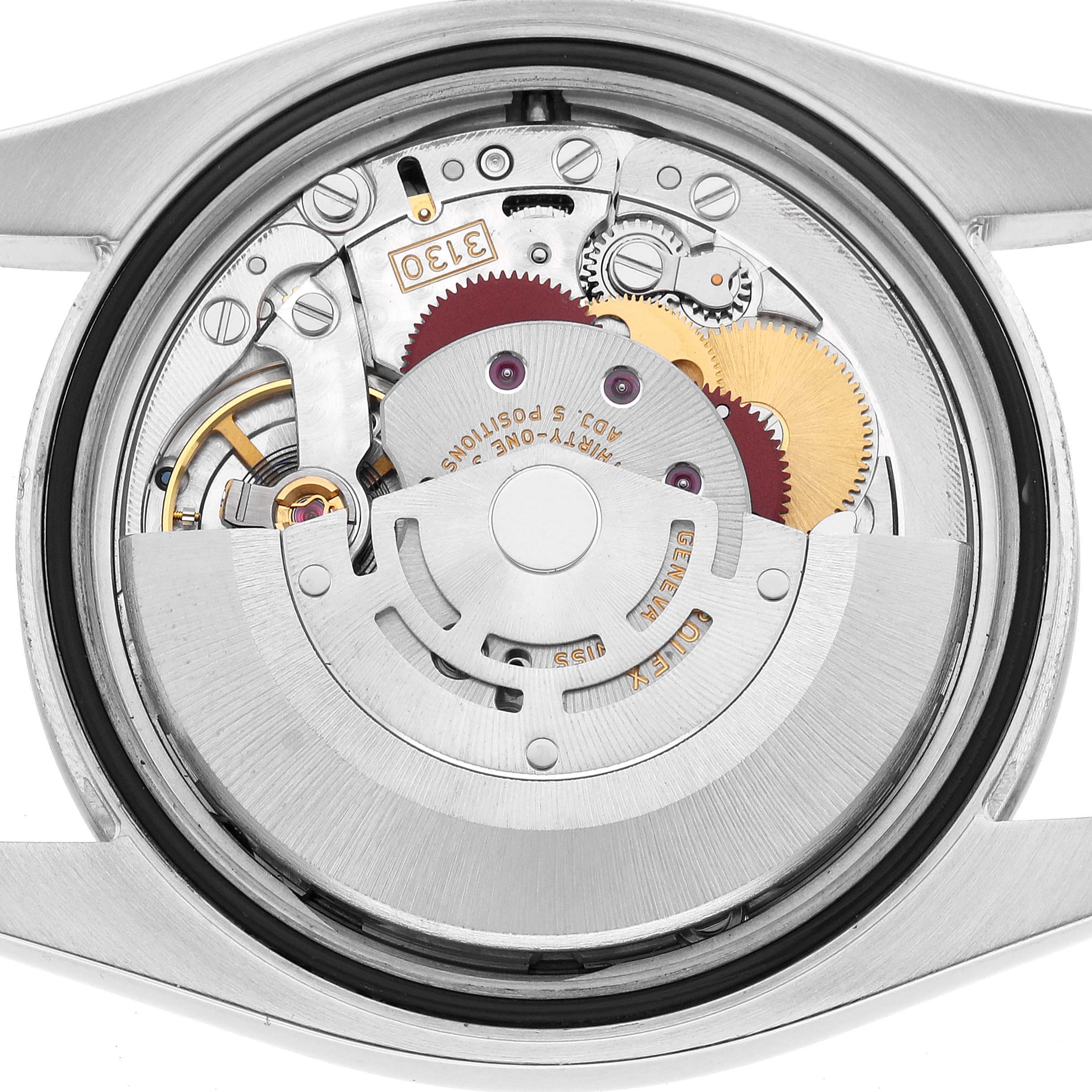 The image shows the internal mechanism of a Rolex Oyster Perpetual 116000 Men's Stainless Steel Silver Dial from the back, highlighting gears and the rotor.