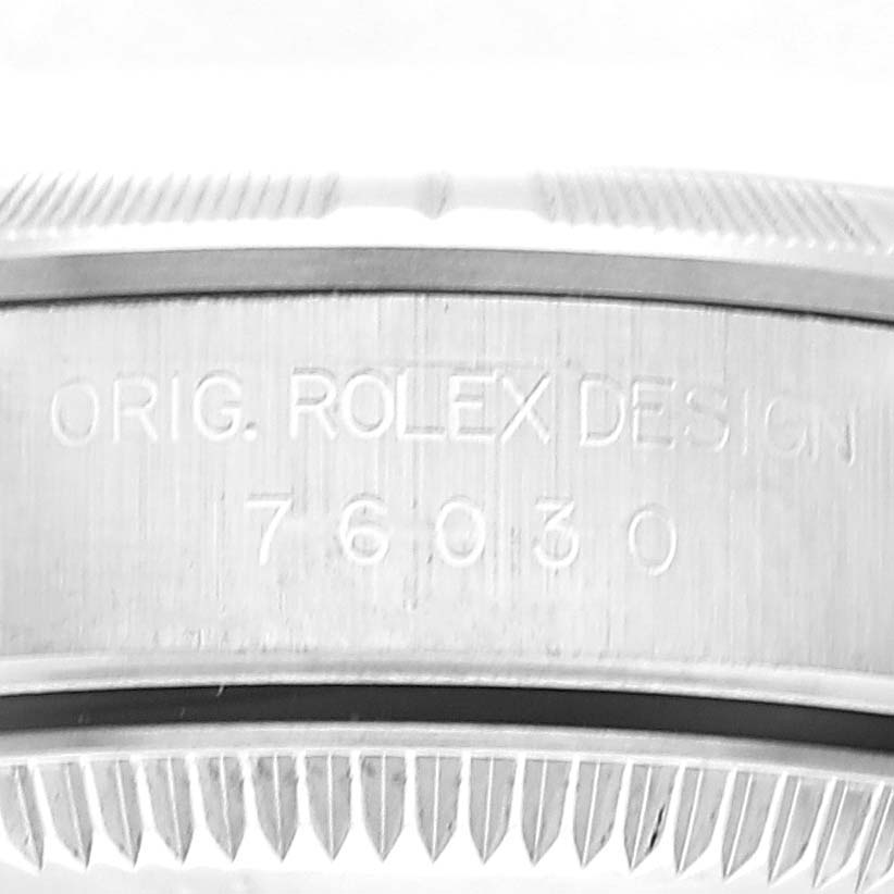 This is a close-up view of the side of a Rolex Oyster Perpetual 76030 Women
s Stainless Steel Pink Dial 76030 Women
s Stainless Steel Pink Dial showing the design number "76030."