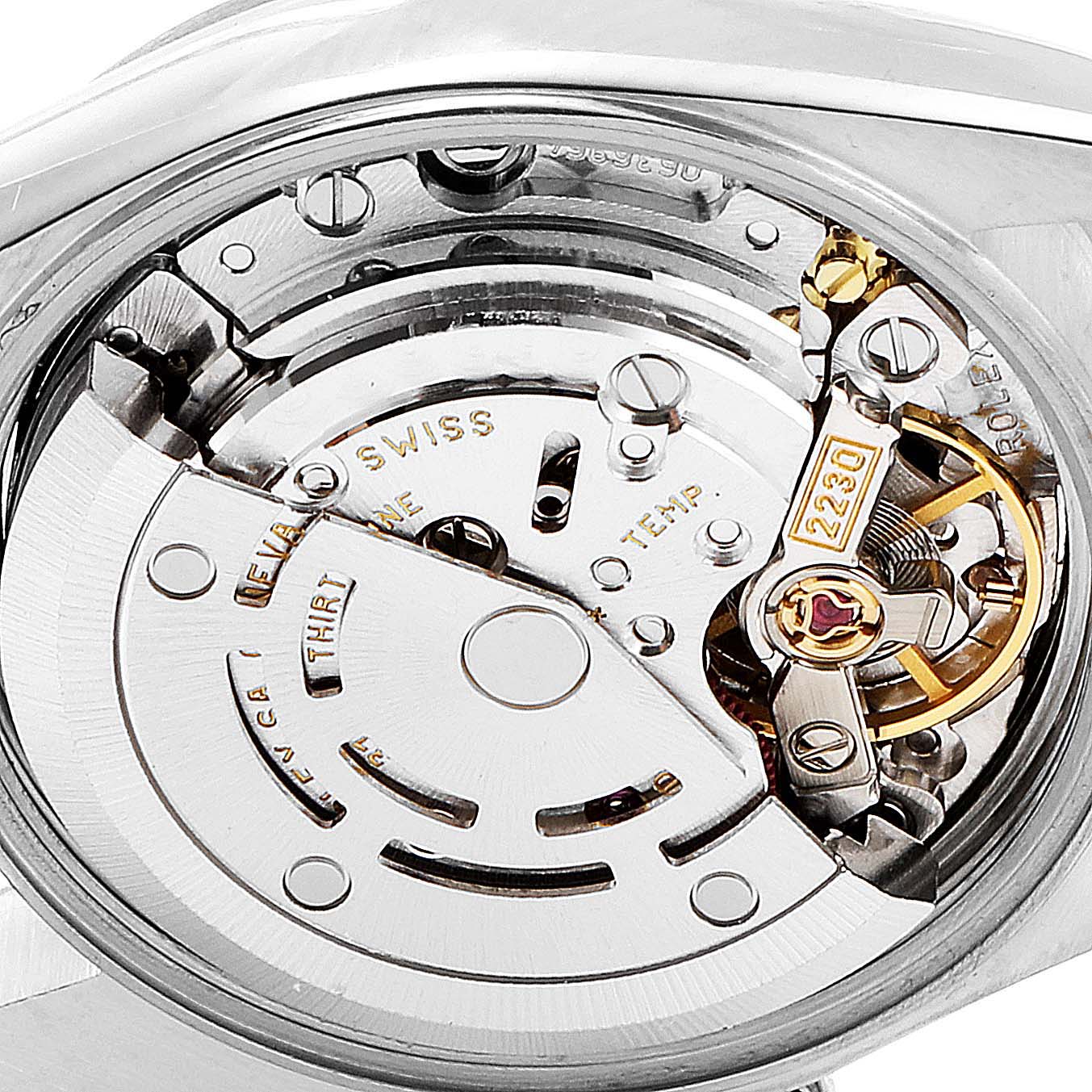 This image shows the internal movement mechanism of the Rolex Oyster Perpetual 76080 Women's Stainless Steel Pink Dial 76080 Women's Stainless Steel Pink Dial watch, highlighting the intricate gears and components.