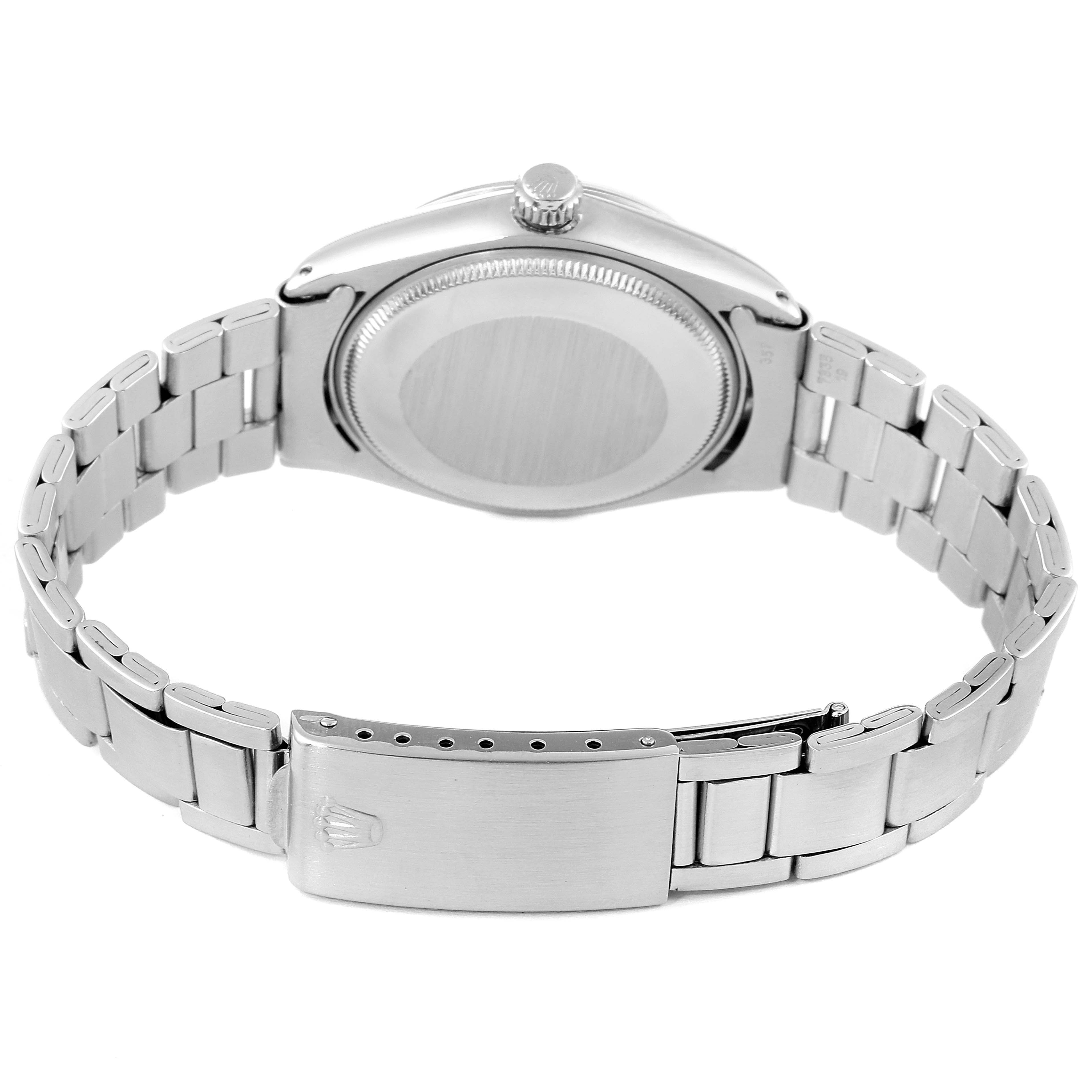 The image shows the backside and strap of the Vintage Collection Rolex watch, highlighting the clasp and stainless steel bracelet.