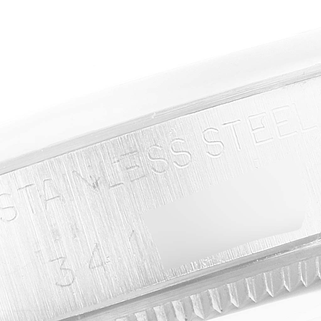 This image shows a close-up of the stainless steel case side with engravings of a Vintage Collection model by Rolex.